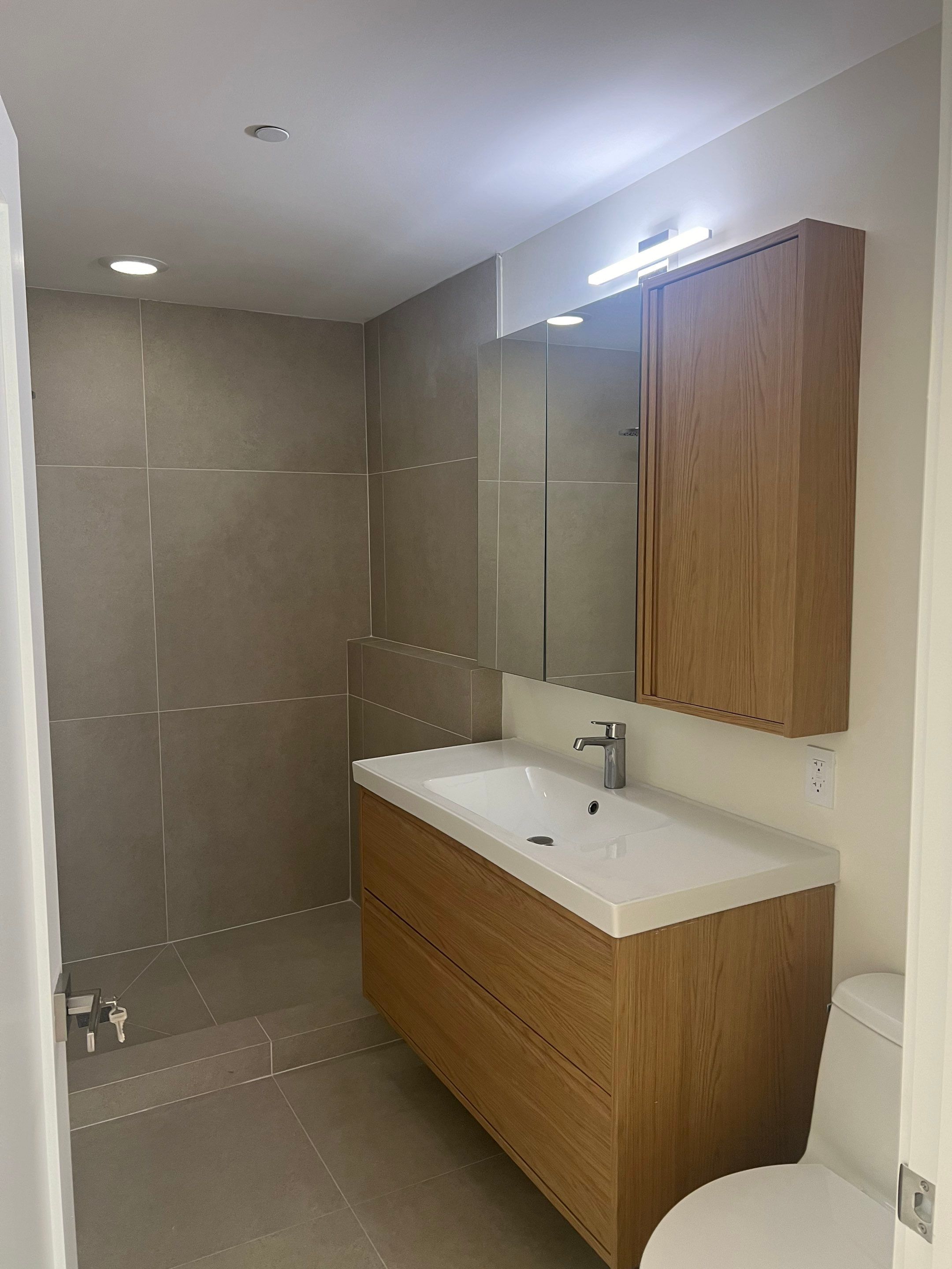 Bathroom and Flooring Renovation by The Goat Contractor ( Giampri Corp)