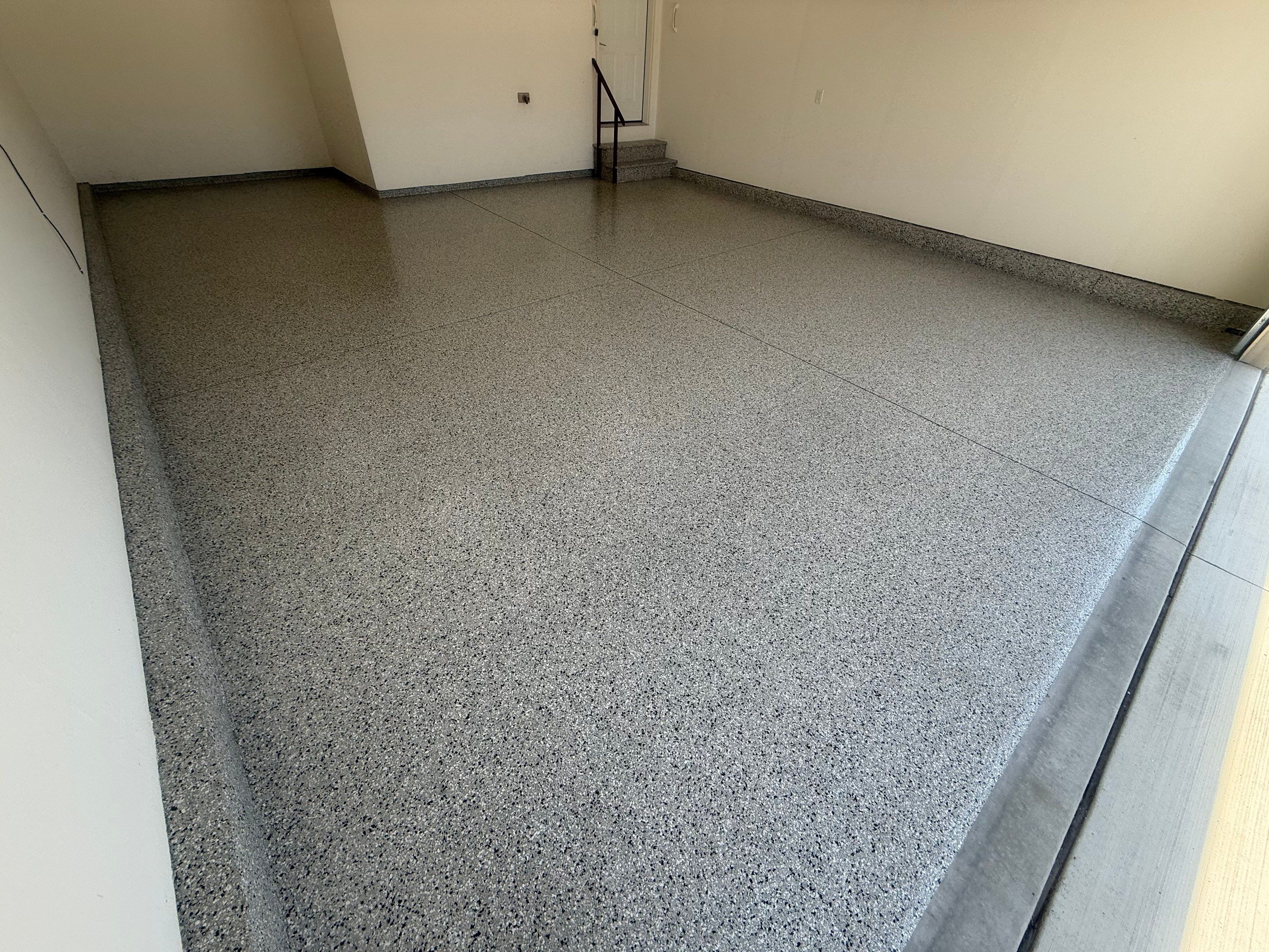 Cabin Fever Garage Floor Coating in Sioux Falls by Select Painting, Coatings & Garage Cabinets