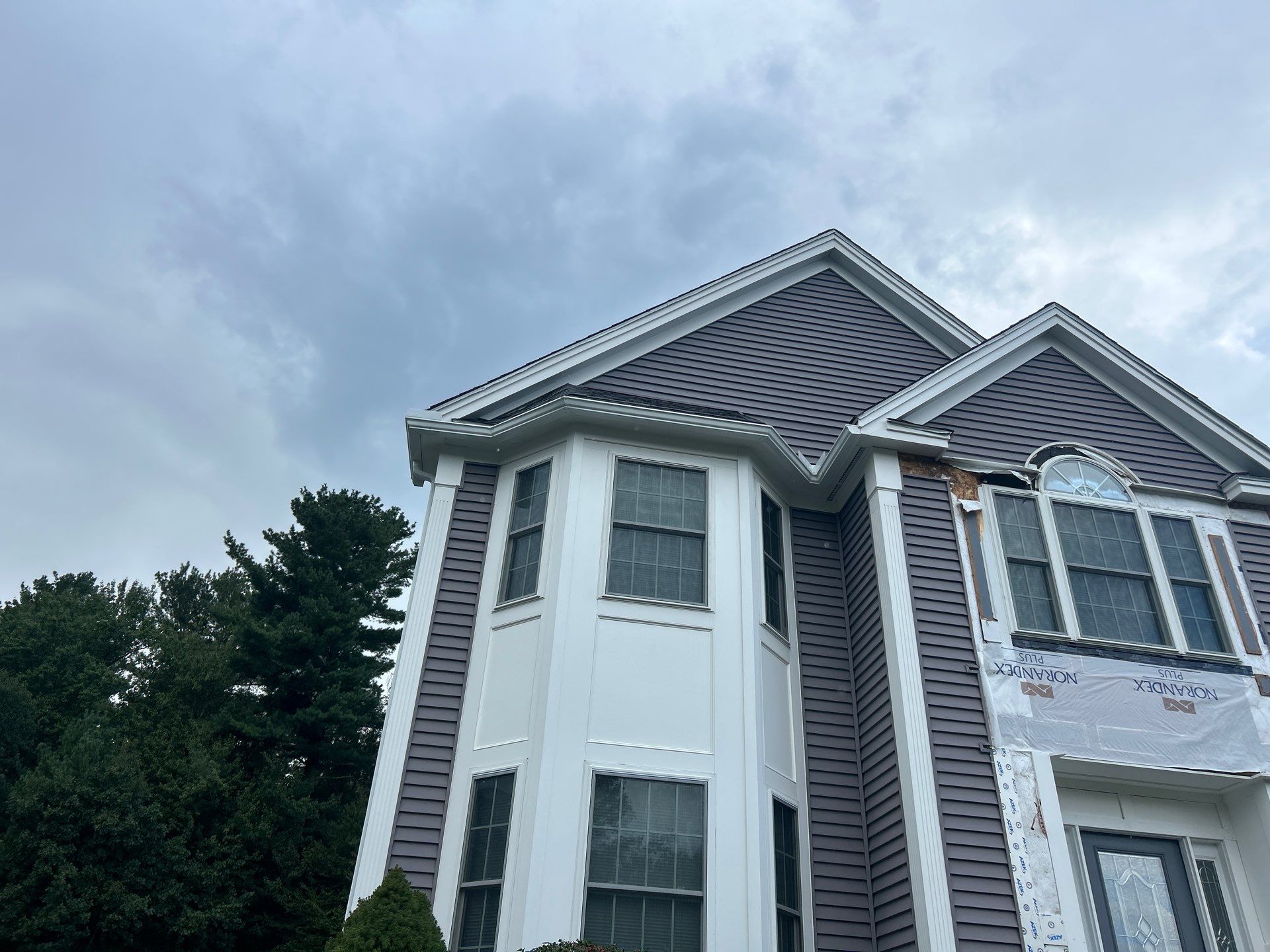 Roof, Trim, Deck, and Gutter Restoration by Mighty Dog Roofing of Greater Middlesex County