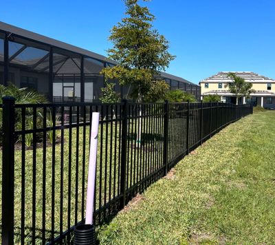 Aluminum Fence Installation using Black 3 Rail Aluminum Fence