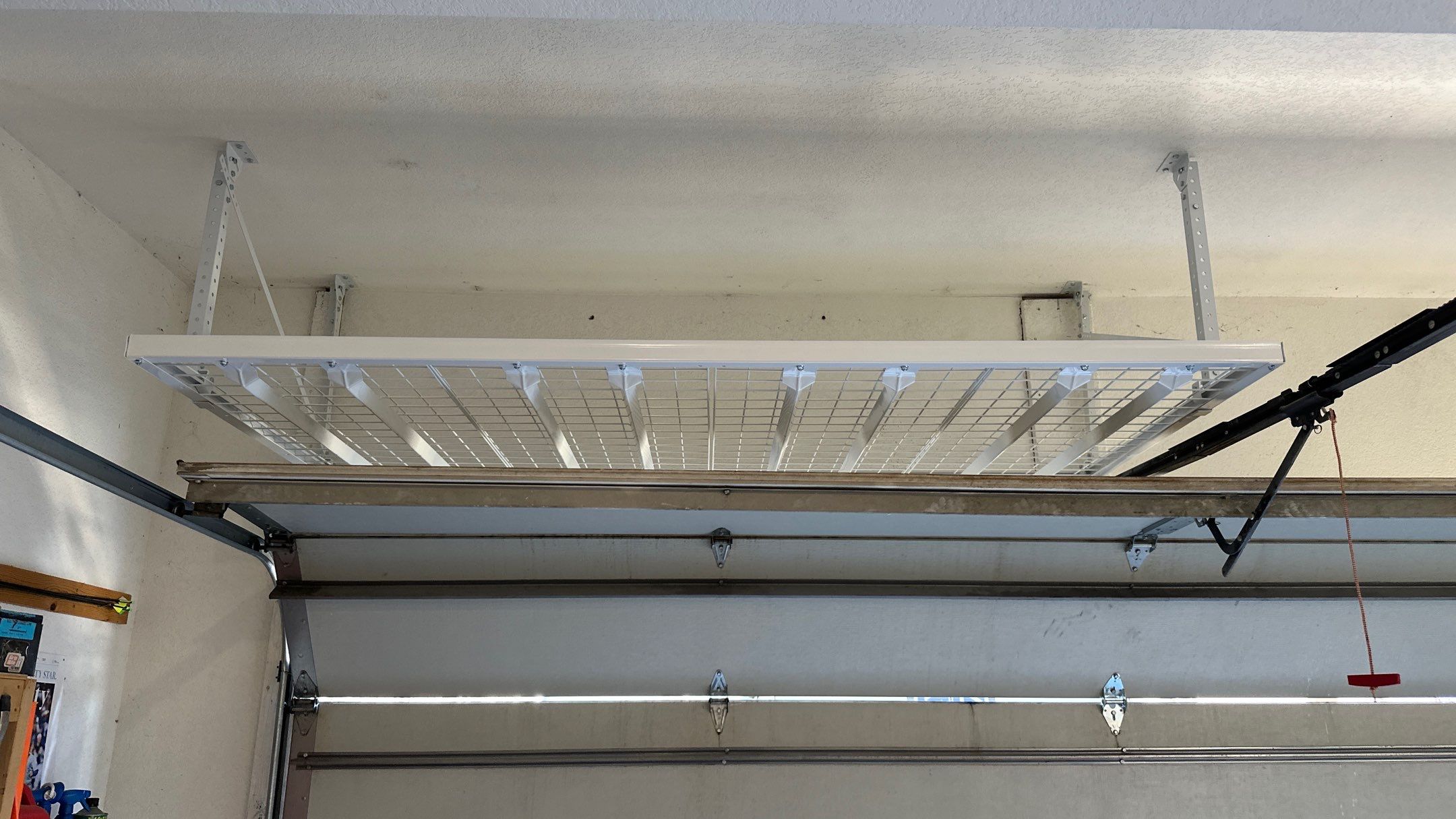 Melissa L. upgraded her garage with slatwall and overhead racks by Banner Garage