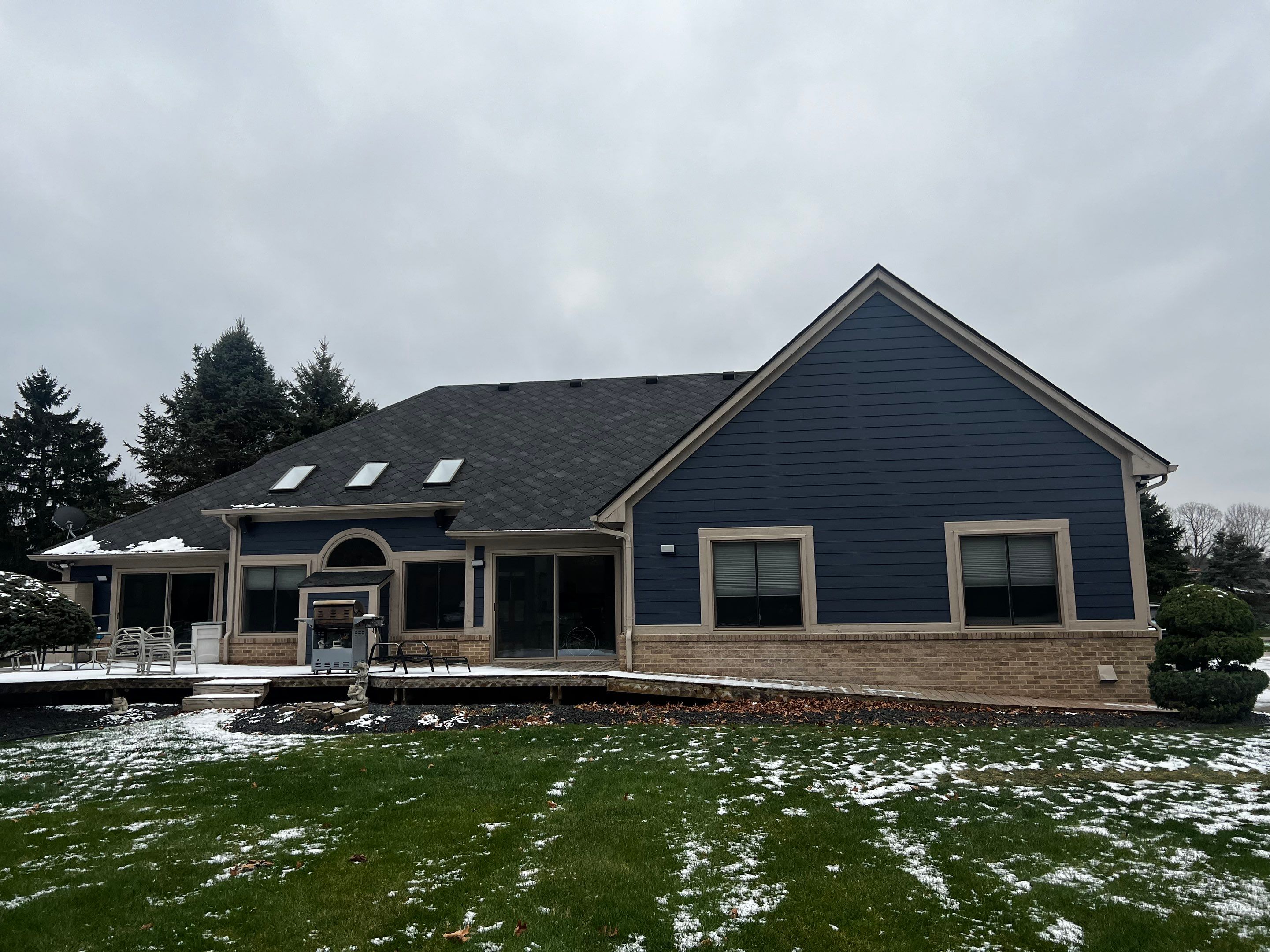 Siding Replacement using James HardiePlank Cedarmill in Deep Ocean color by Bloomfield Construction & Restoration