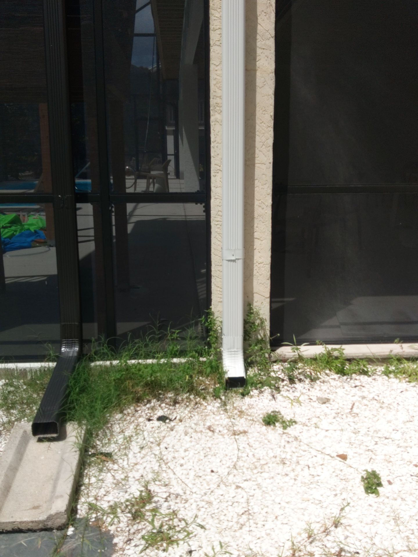 Complete Gutter System with Downspouts & Guards in Fort Myers Beach FL by Gutter Professors