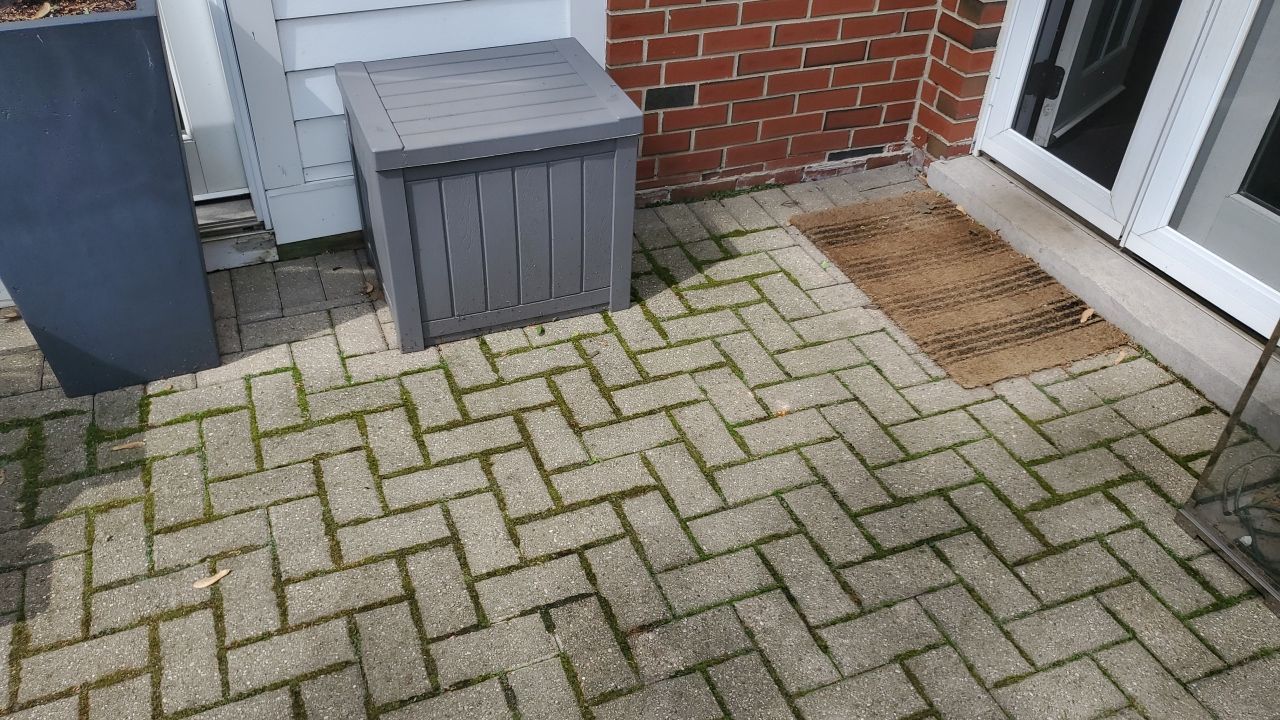 Brick patio repair, clean sand and seal by Northern Power Washing LLC.