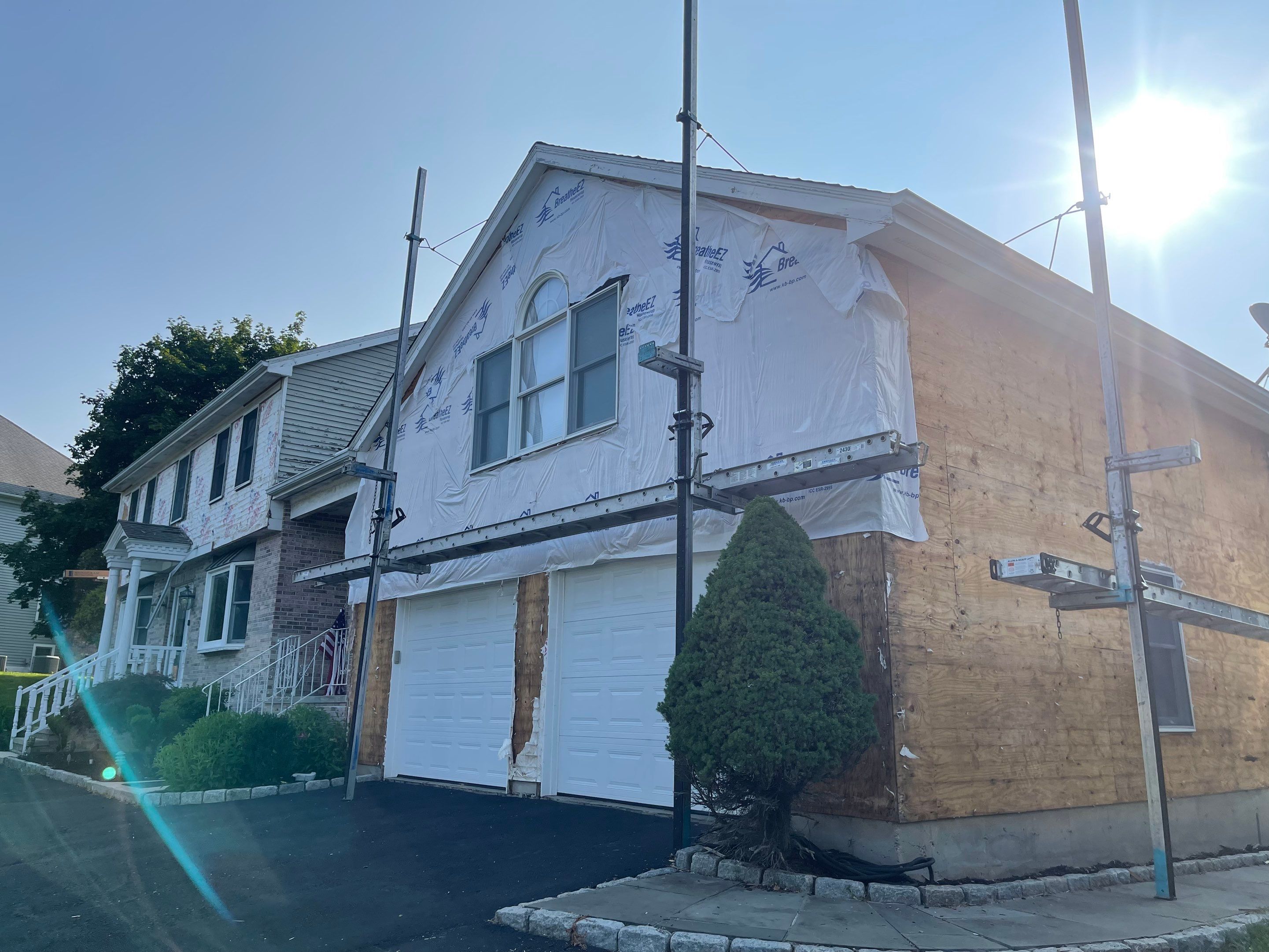 Siding Installation using Mainstreet Colonial & White gutters by A Plus Exterior
