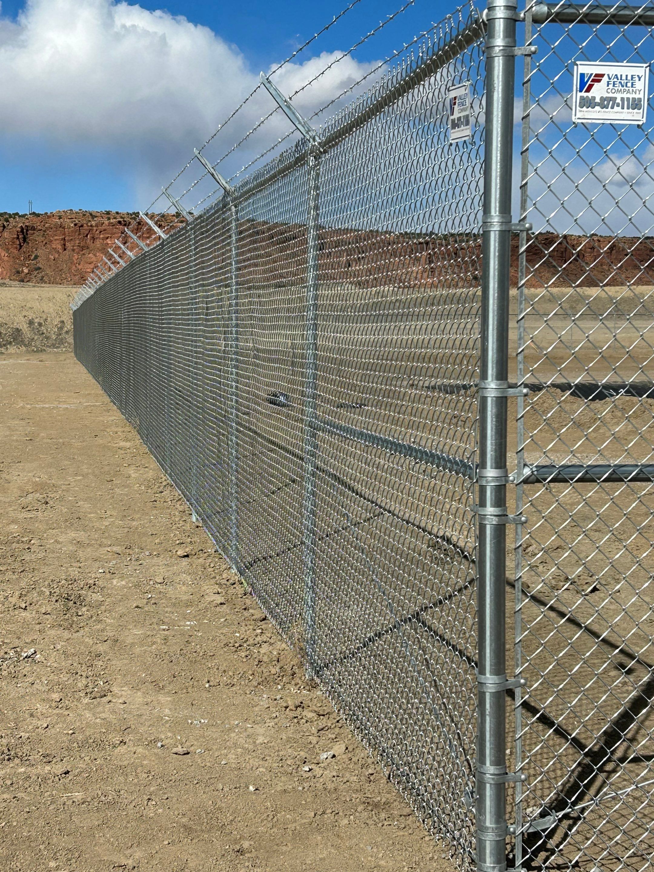 Commercial  using 8'+1' 9ga chain link by Valley Fence Company