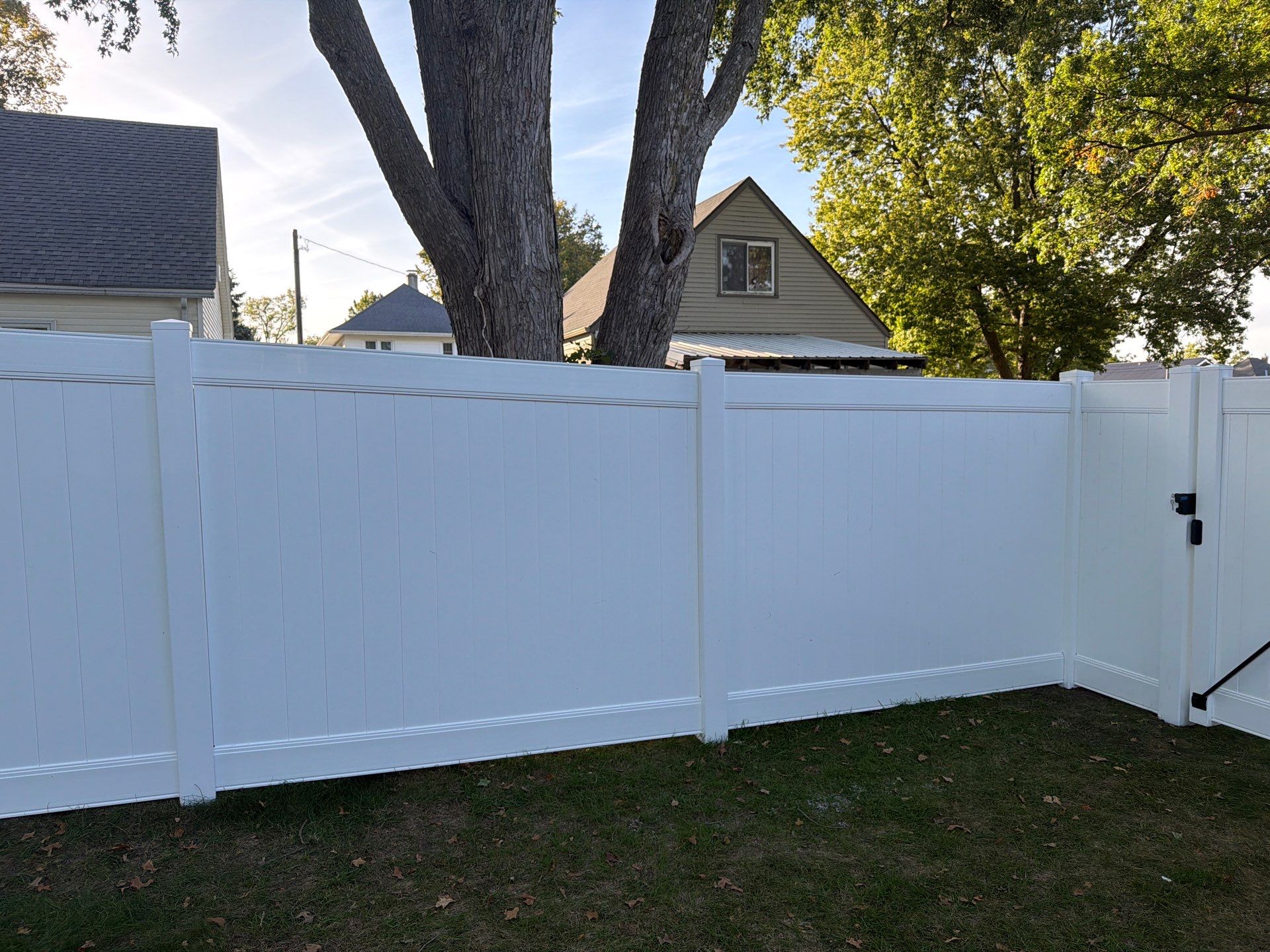 White Vinyl Privacy Fence and Gate Installation in Grundy Center by Perfect Picket Fence and Stain