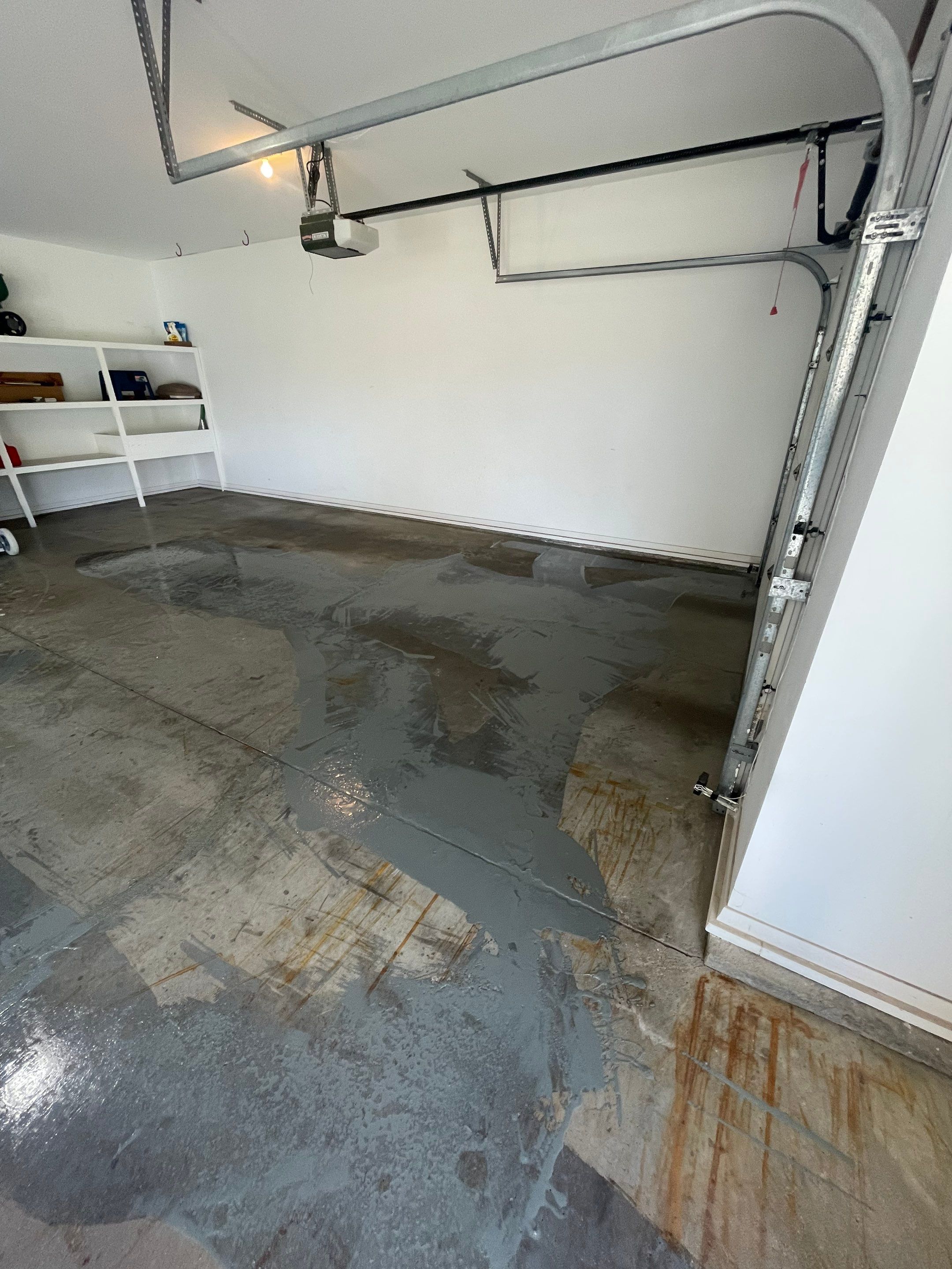 Yankton Garage Floor Restoration with Gray Speckled Epoxy Coating by Select Painting, Coatings & Garage Cabinets