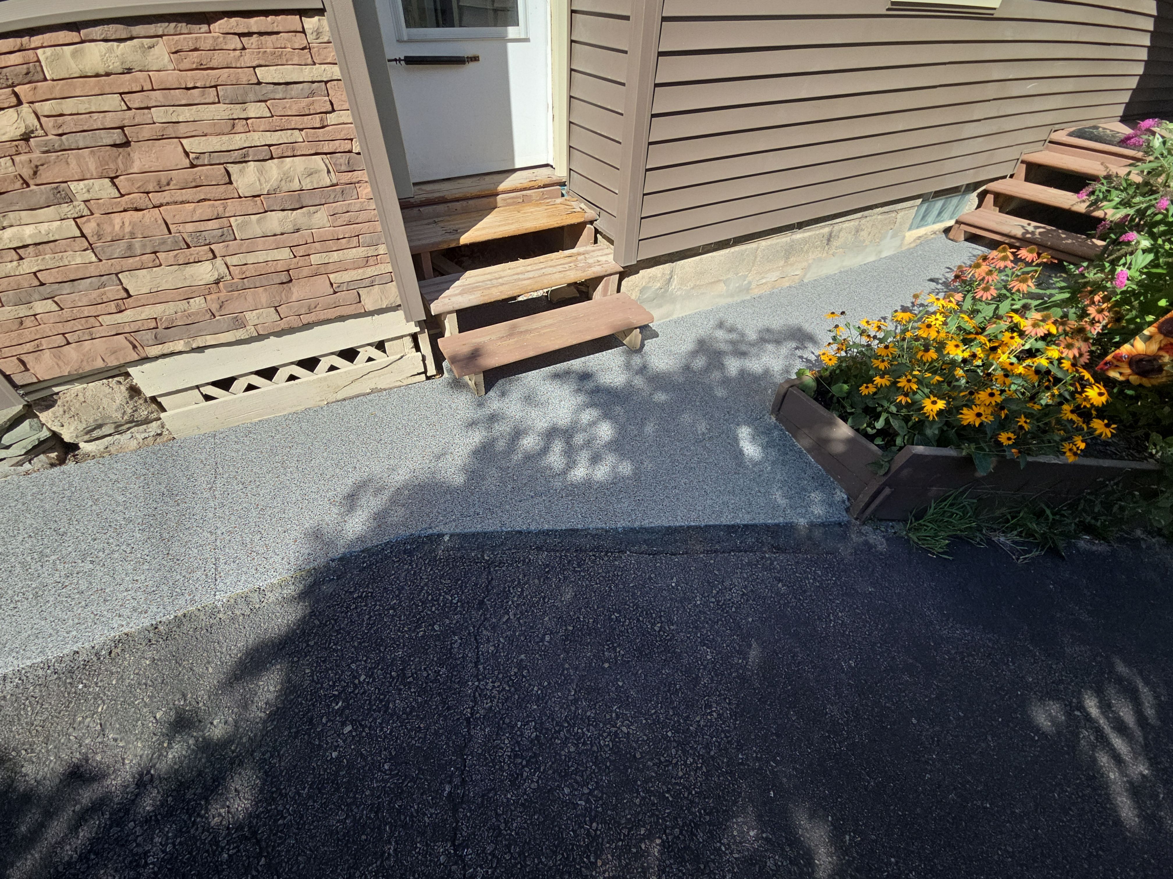 Earth Effects Stardust Sidewalk Coating by NG Masonry & Construction LLC