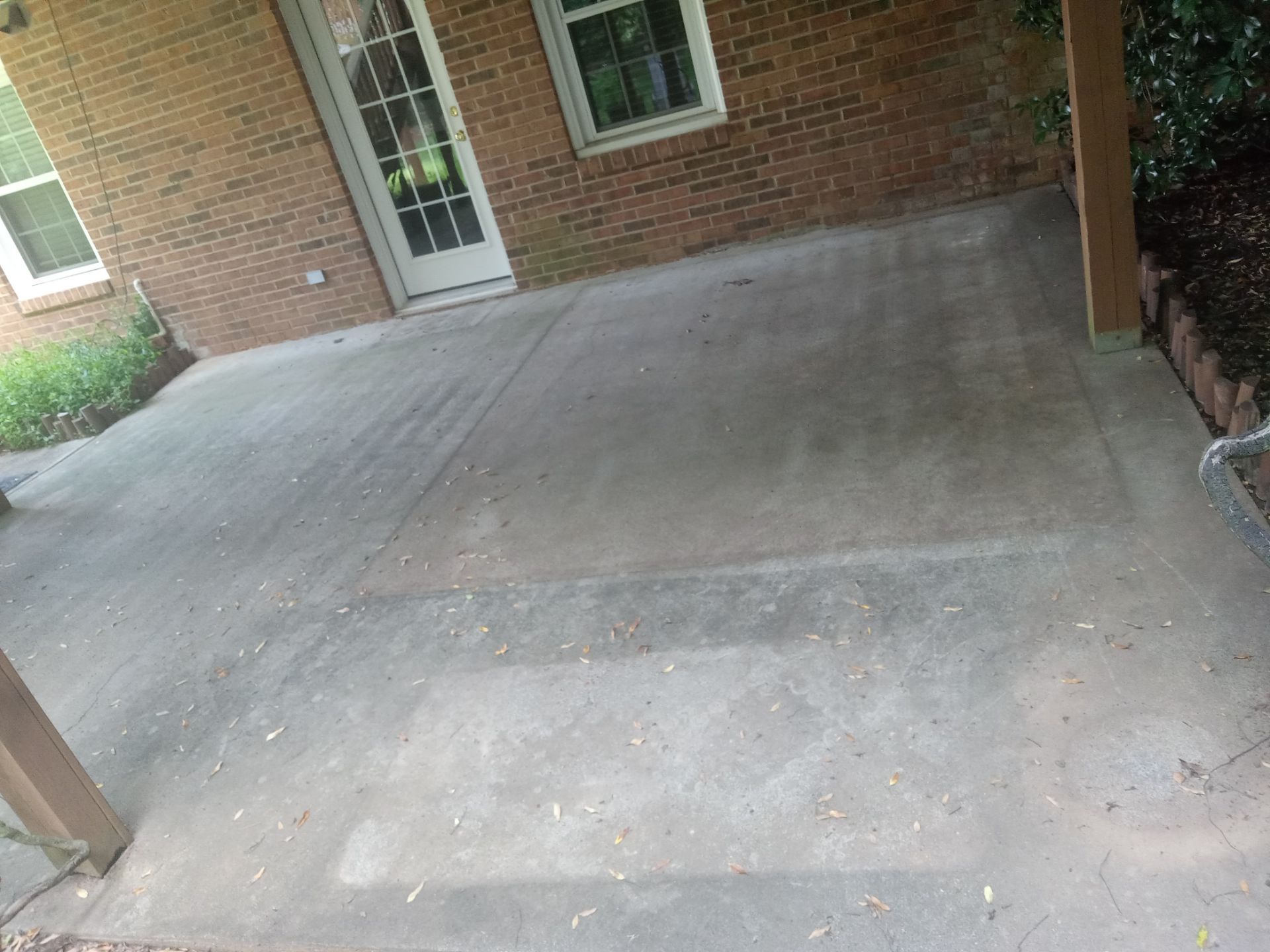 pressure washing concrete driveway removing dirt mildew for clean appearance