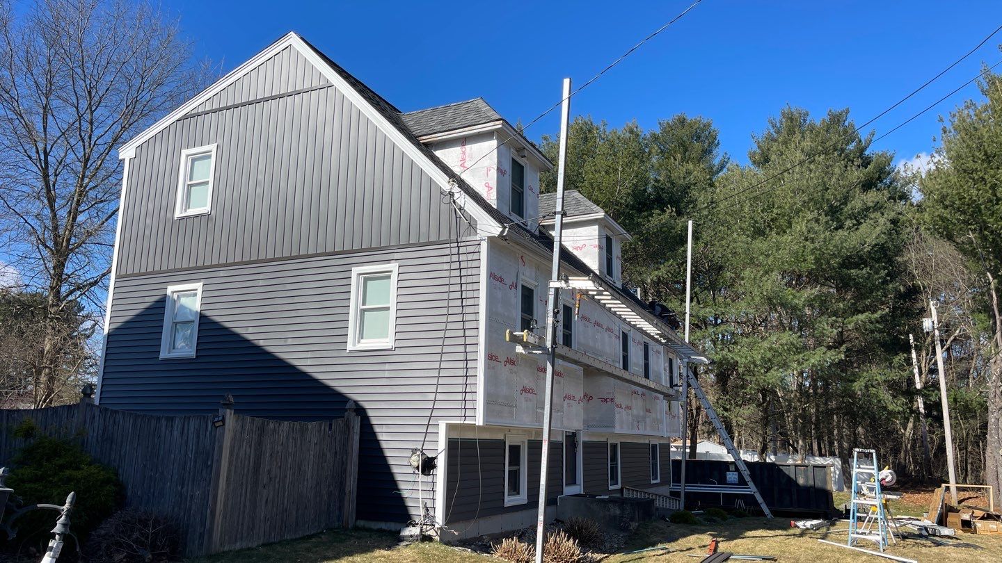 Complete Exterior Renovation with New Siding & Gutters   by Sensible Home Solutions