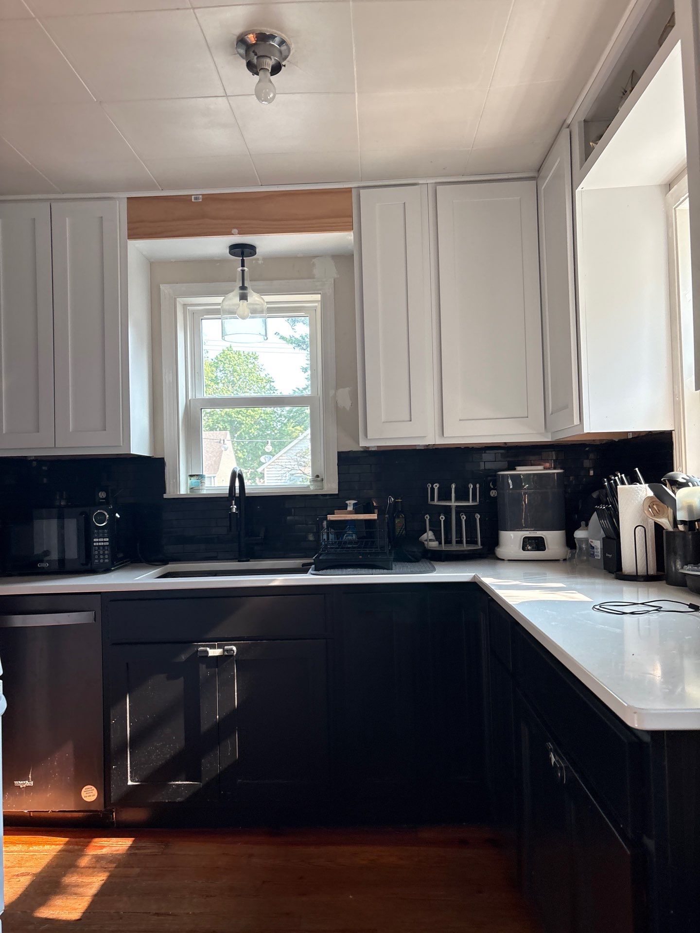 Lincoln Kitchen Remodel With Black and White Two-Tone Cabinetry by CompanyCam Sales Demo