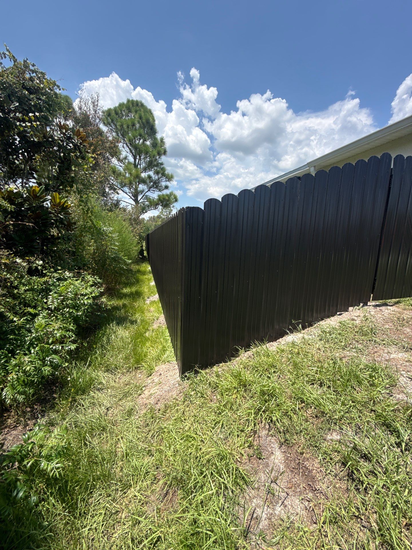 Black Scalloped Metal Privacy Fence Installation in Punta Gorda by True Fence LLC