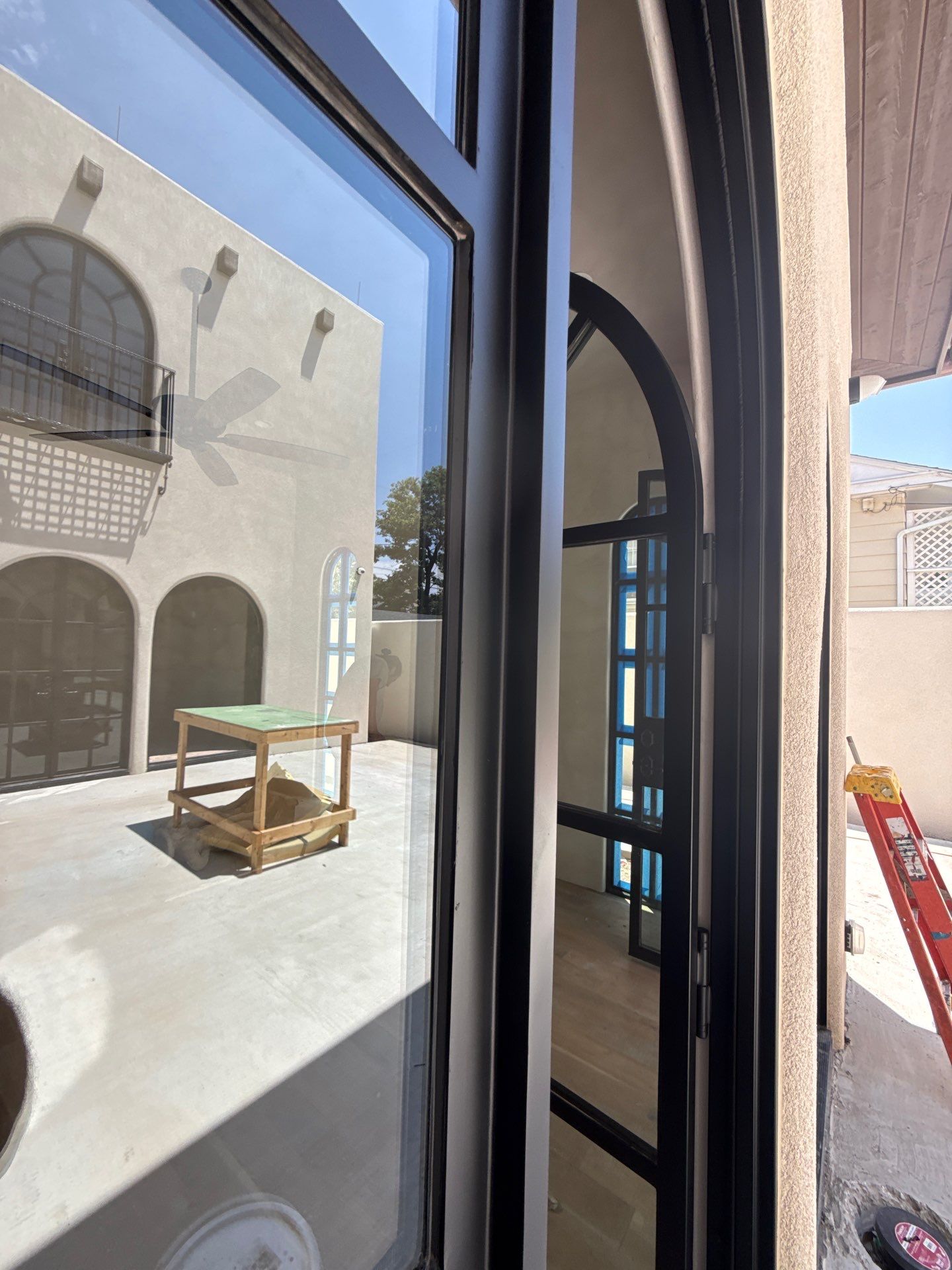 Arched Black Metal French Door Installation and Finishing in Fort Worth by Solara Custom Living