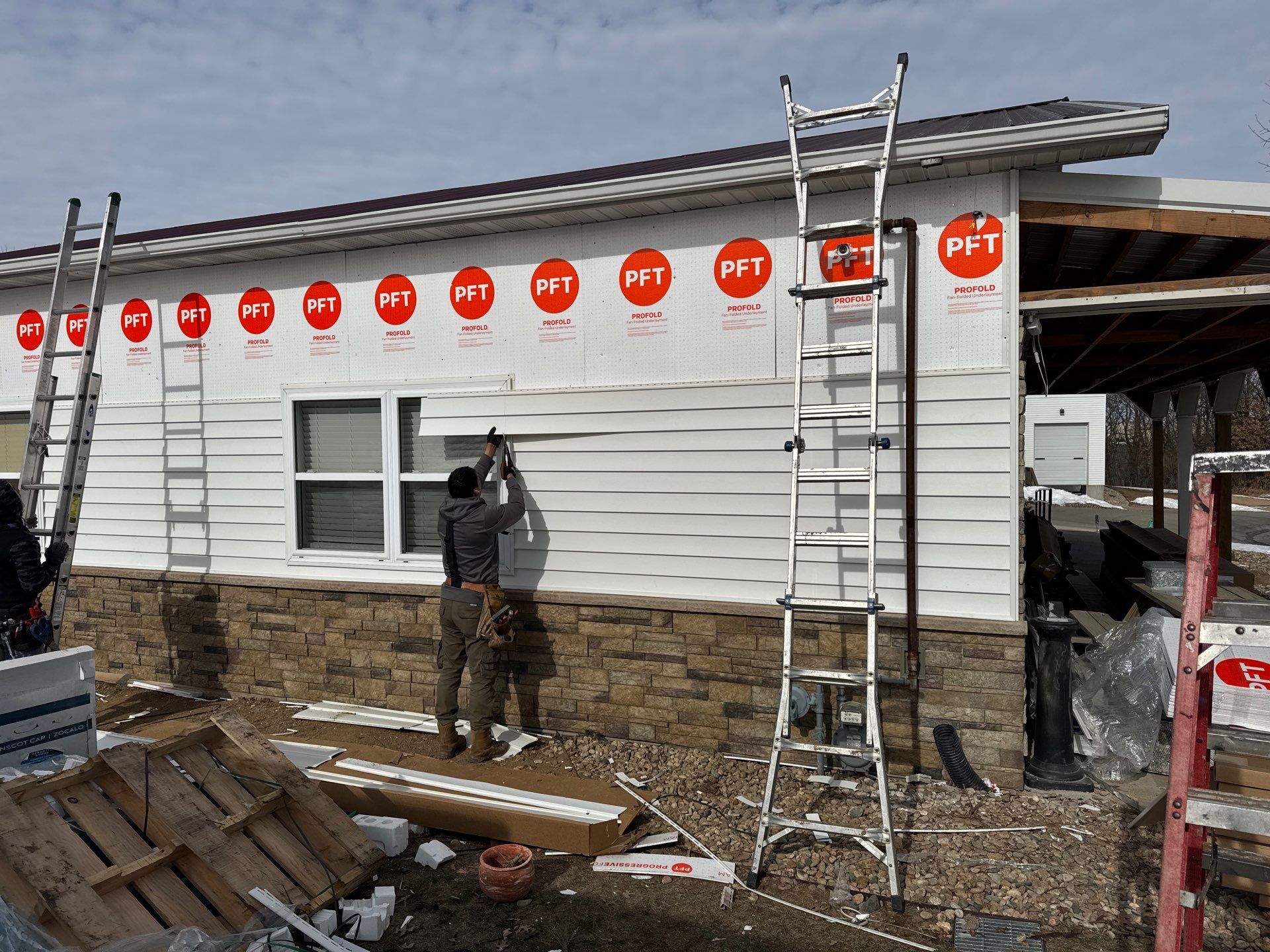 Siding and Stone Installation using Extrerior Porfolio Vinyl Siding and Versetta Stone by EEC  Windows, Siding & Roofing 