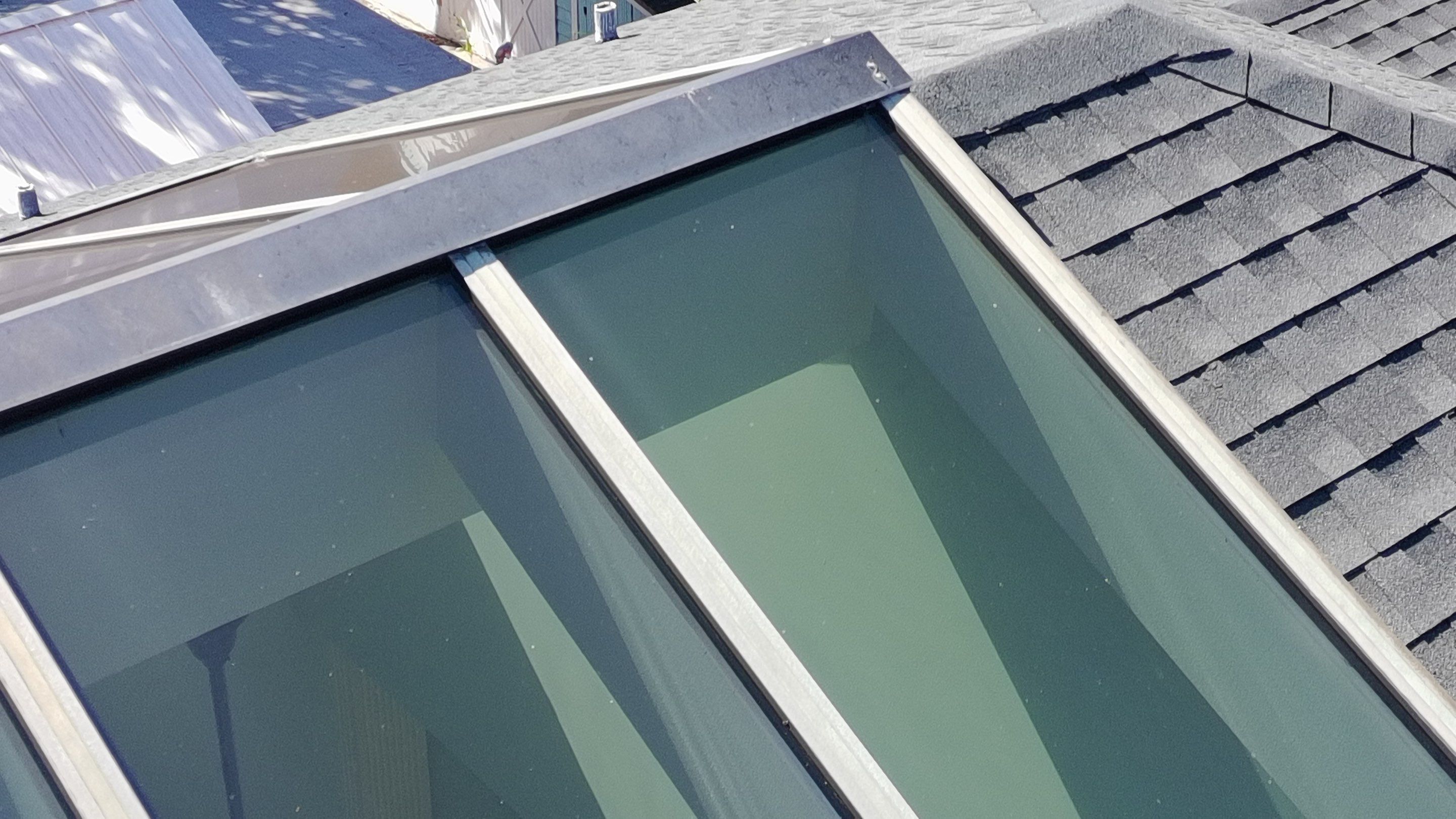 Ridge Skylight Repair and Shingle Roof Maintenance in Winter Park by Fortified Roofing Solutions Corp.