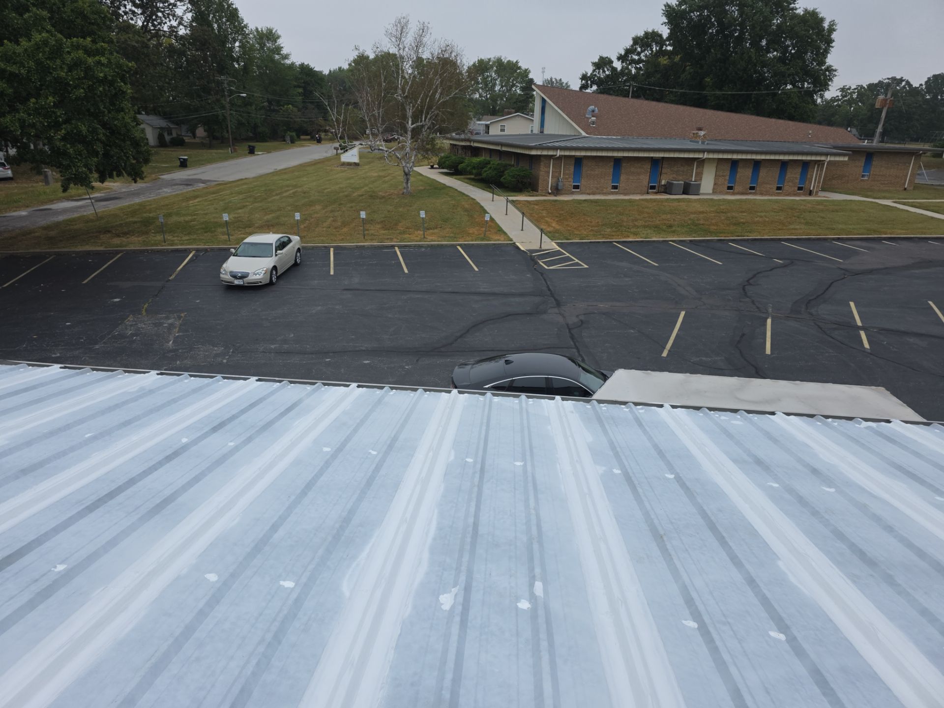 Commercial Roofing Install - Metal Coatings Restoration System  - Color White  by Titan Commercial & Residential Roofing 