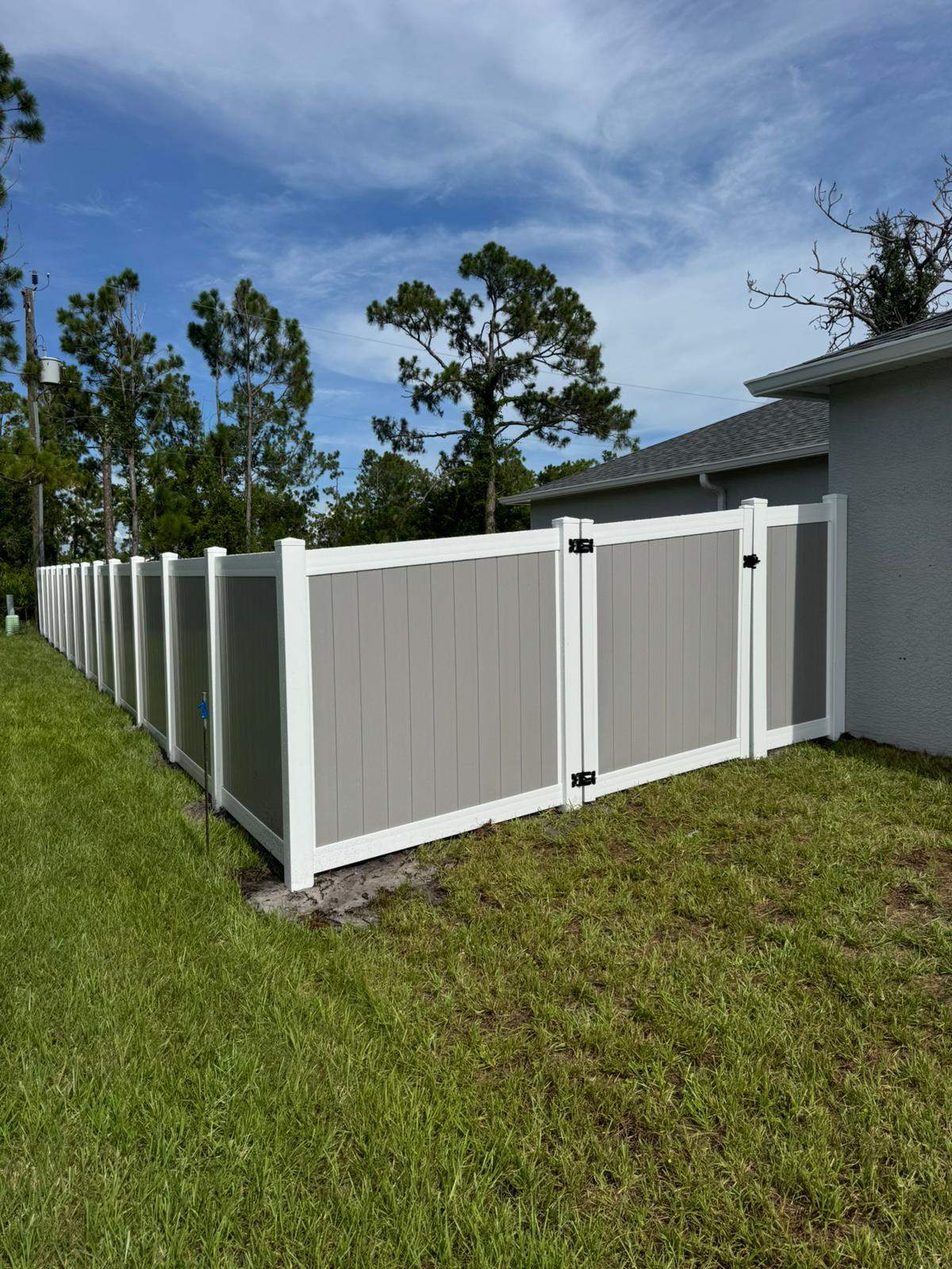 Two-Tone Vinyl Privacy Fence Installation in Port Charlotte by True Fence LLC