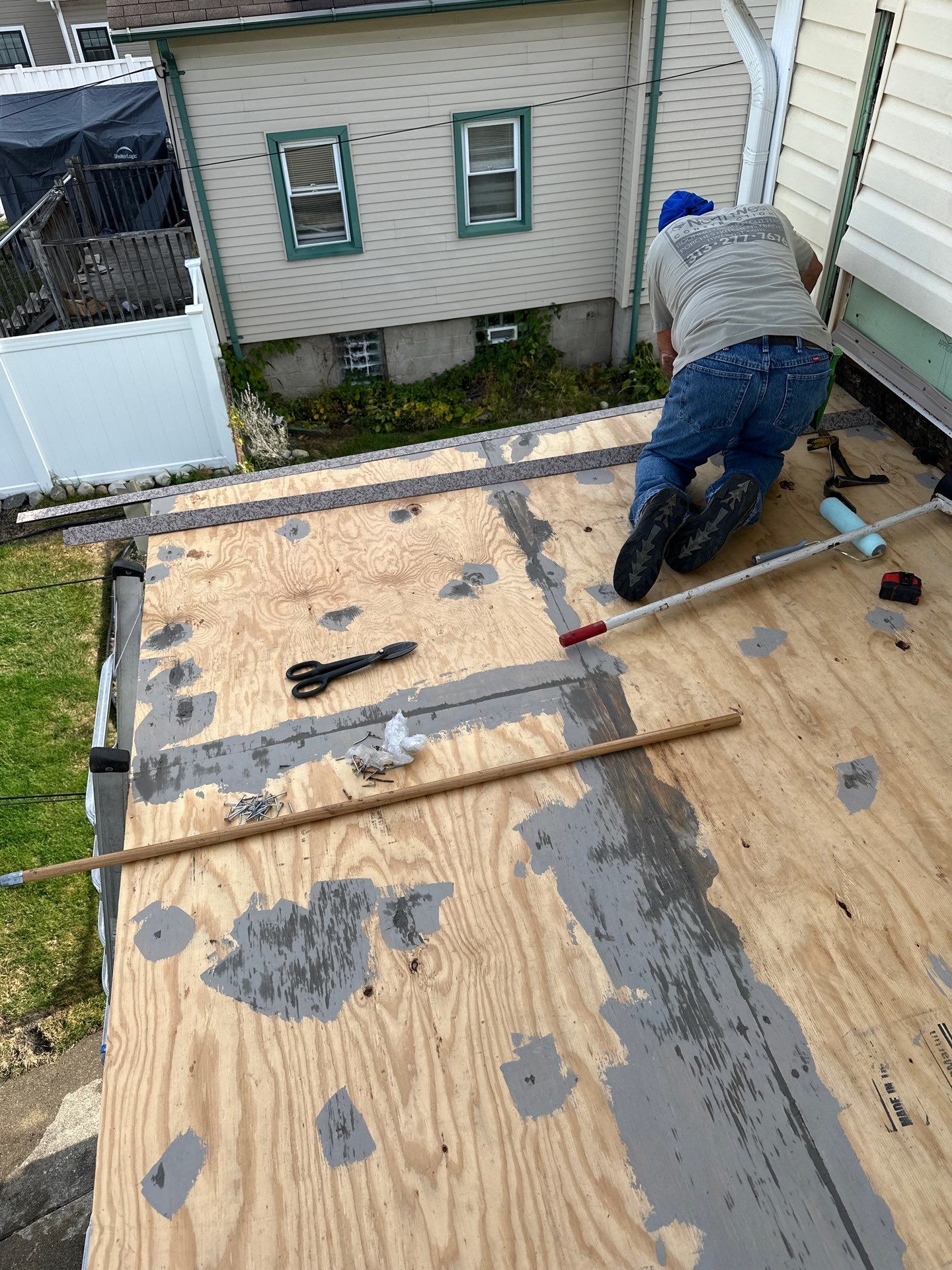 Rebuild balcony flat roofing TREX decking stairway and Railings in Wyandotte, MI by Northwest Construction 