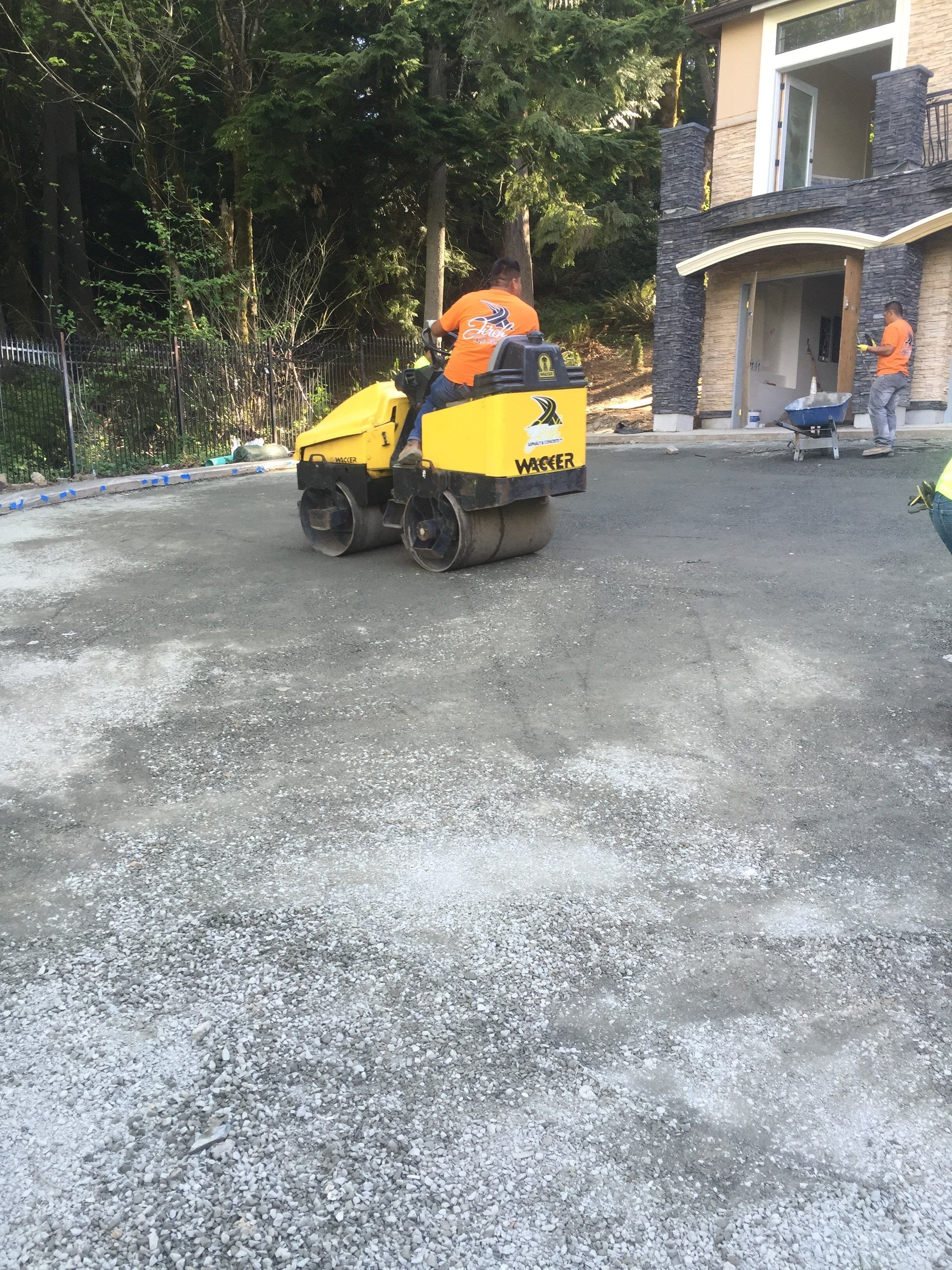 Asphalt Driveway and Stamped Concrete Patio Finish  by Jireh Asphalt & Concrete Inc 
