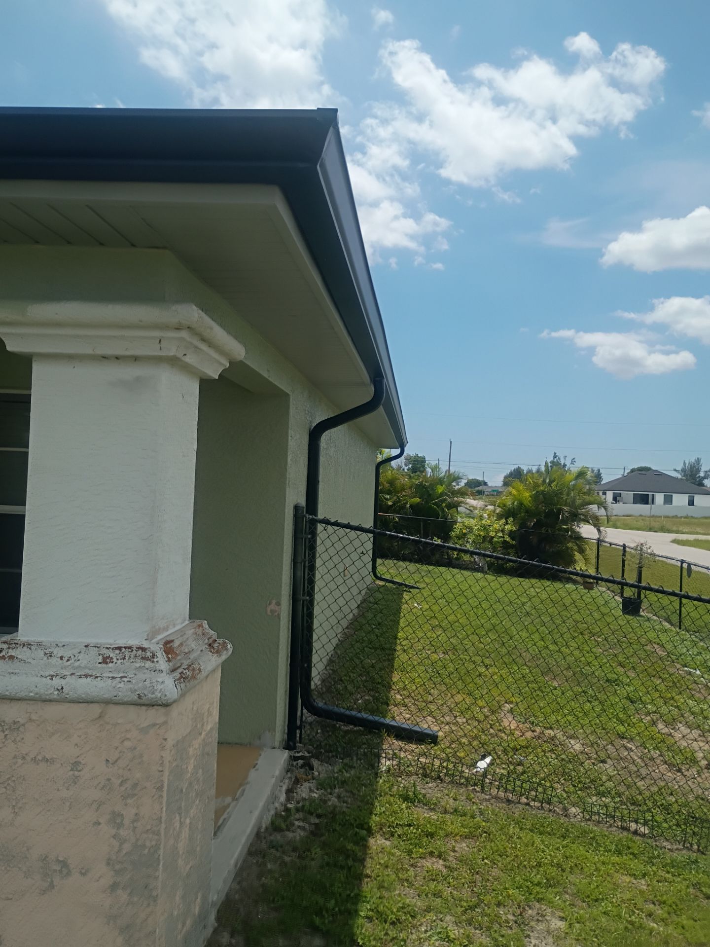 Black Seamless Gutters using K-Style Seamless Gutters in Cape Coral FL by Gutter Professors
