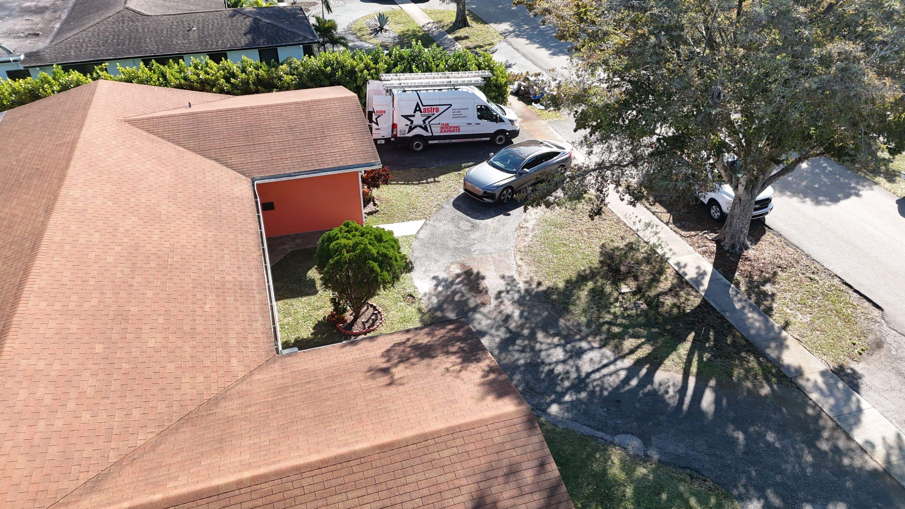 Insulated Screen Enclosure and Wood Tile Deck Installation in Plantation by Aastro Roofing