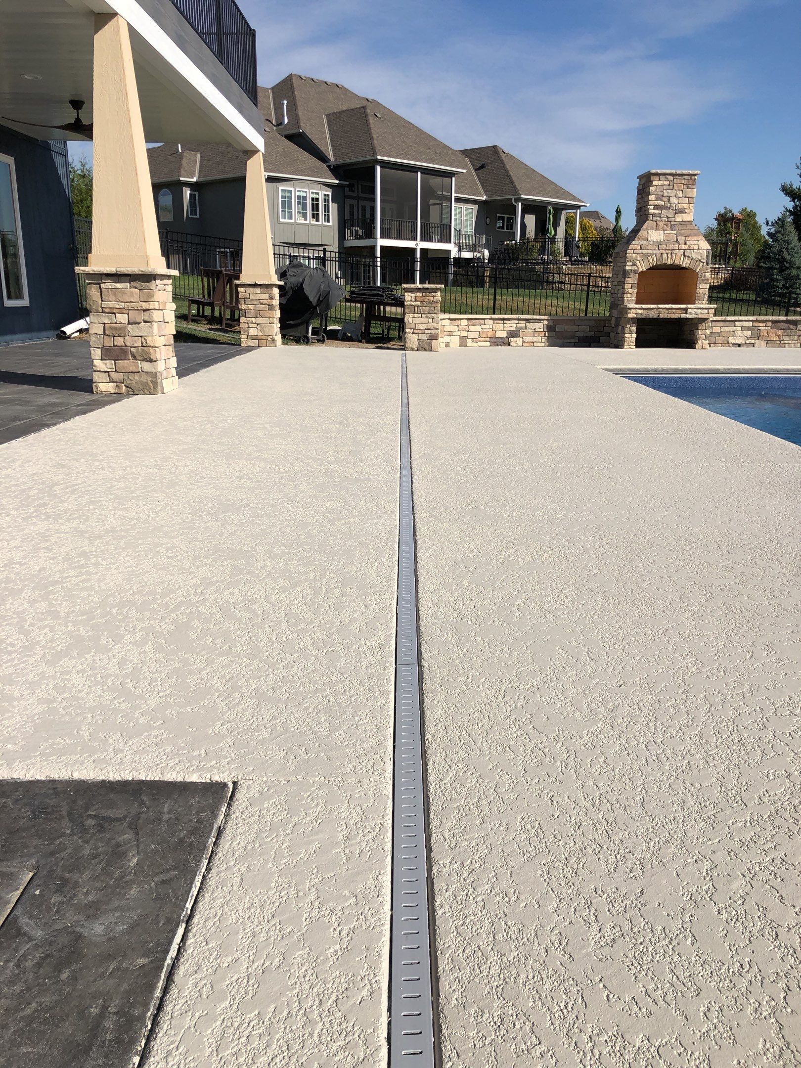 Parkville, MO -- Pool Deck Coating with Classic Texture (knockdown) finish by Big Red Decorative Concrete, LLC