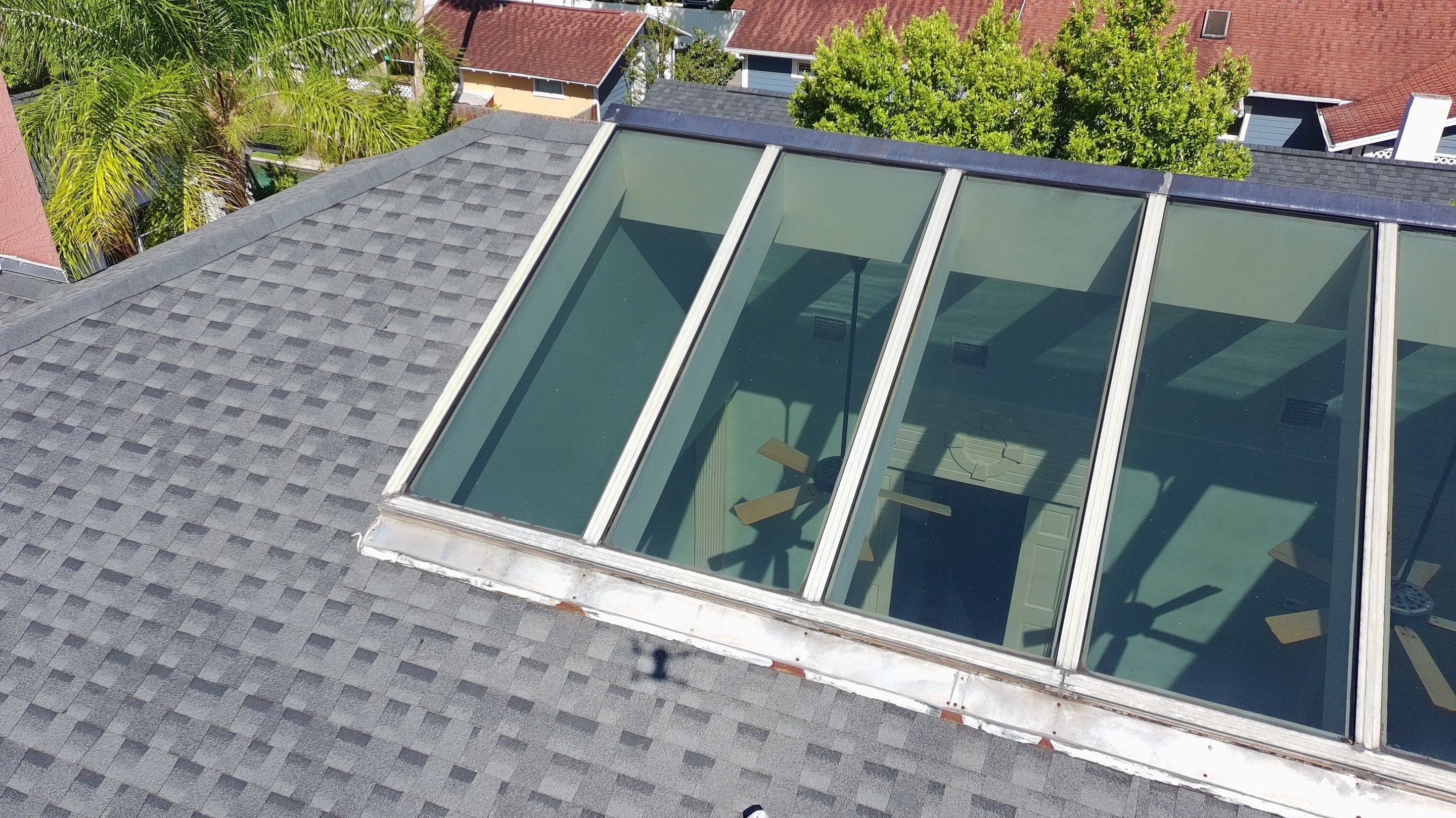 Ridge Skylight Repair and Shingle Roof Maintenance in Winter Park by Fortified Roofing Solutions Corp.
