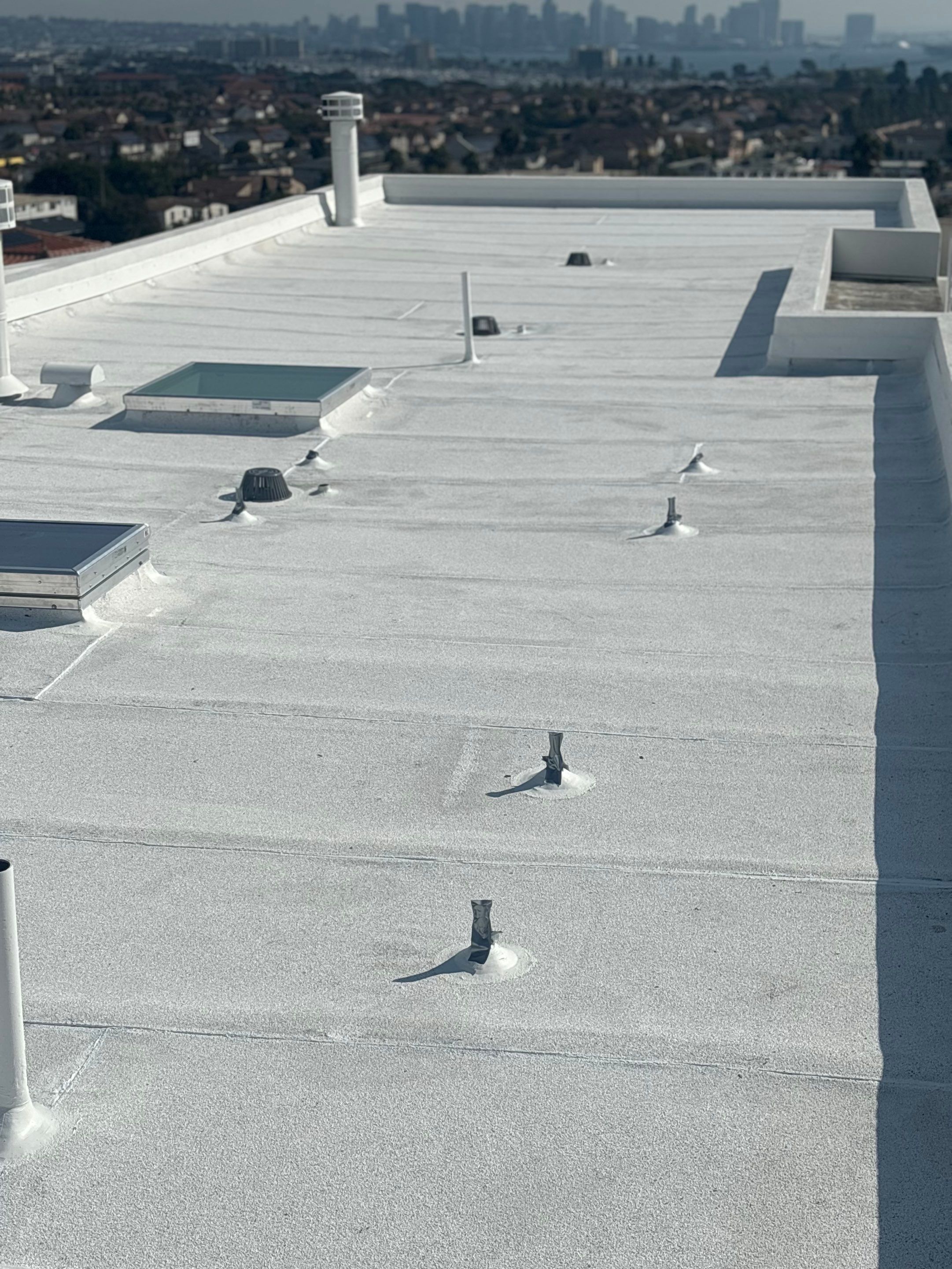Point Loma Flat Roof Replacement – Johns Manville Bright White Torch-Applied Roofing System by Zenith Roofing Services 