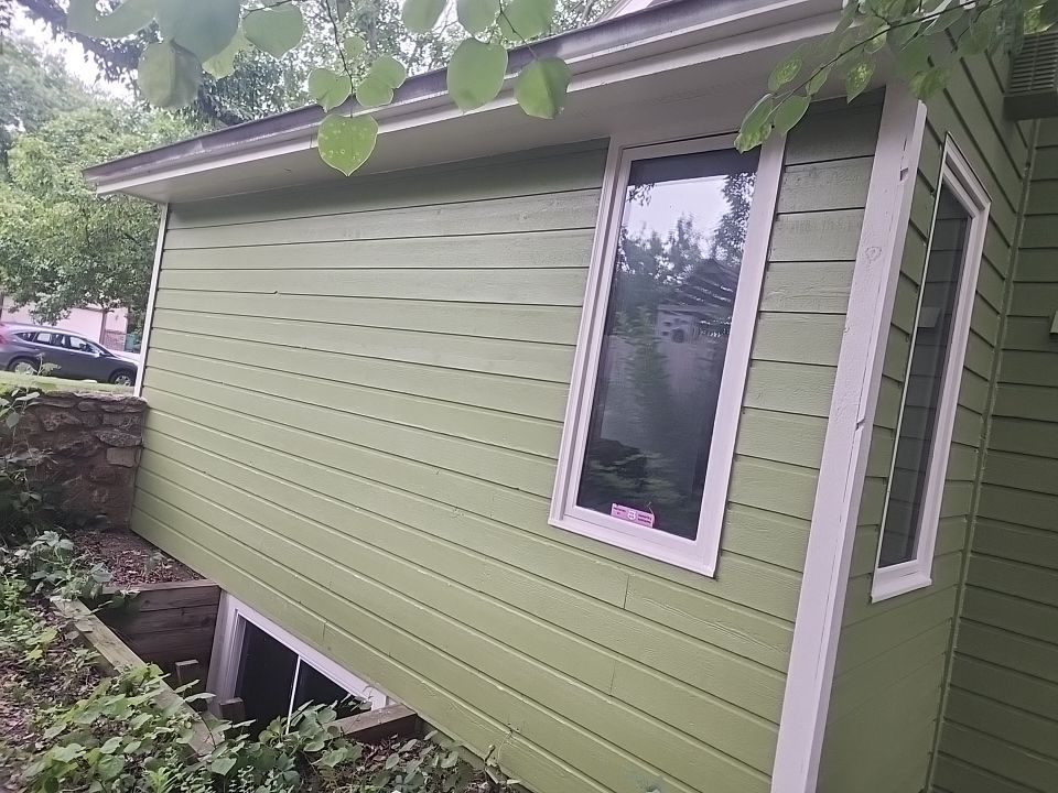 Complete house repaint to a different color  by Cutting edge painting 