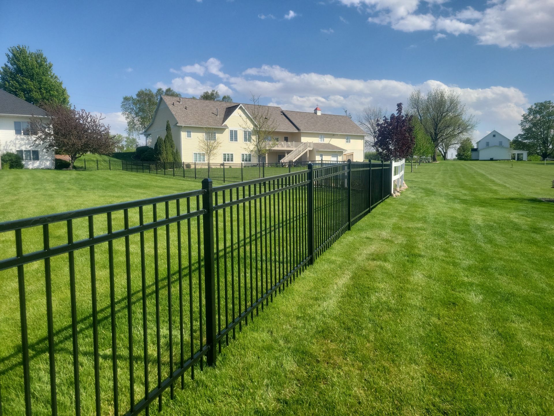 Black Ornamental Metal Picket Fence Installation in Waterloo by Perfect Picket Fence and Stain