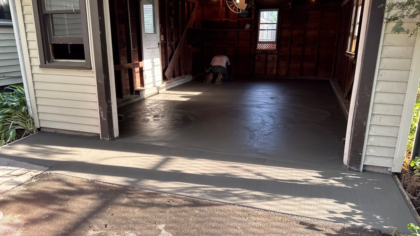 Concrete garage floor replacement  by NG Masonry & Construction LLC