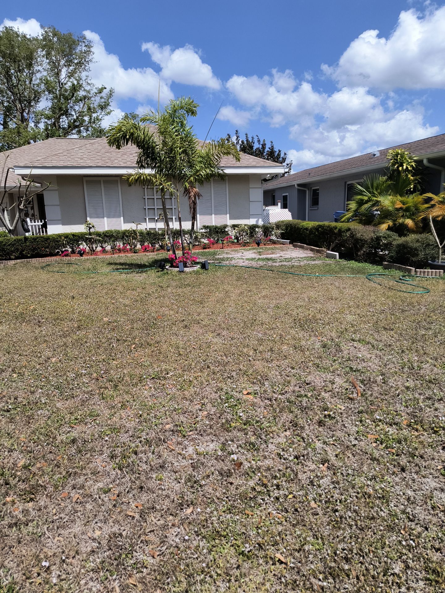 Gutter Project with White 6-K Seamless Gutters Installation and Downspouts in Sarasota FL by Gutter Professors