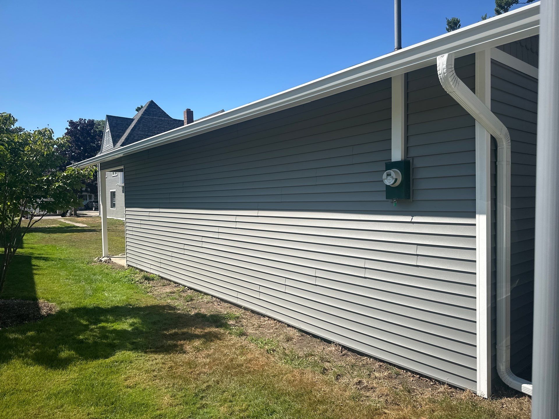 Complete Gutter and Downspout Installation in Charlevoix by Rainbow Seamless Systems
