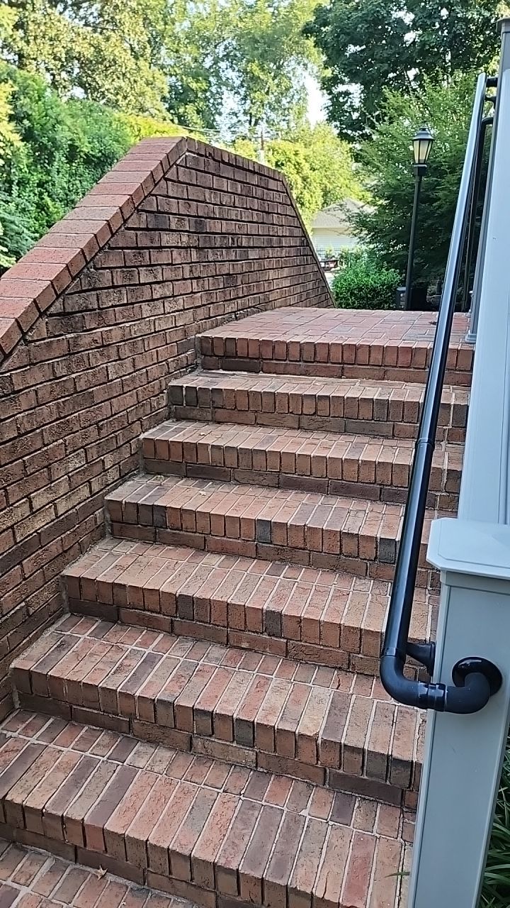 building clean using cleaner by Power Wash Masters LLC