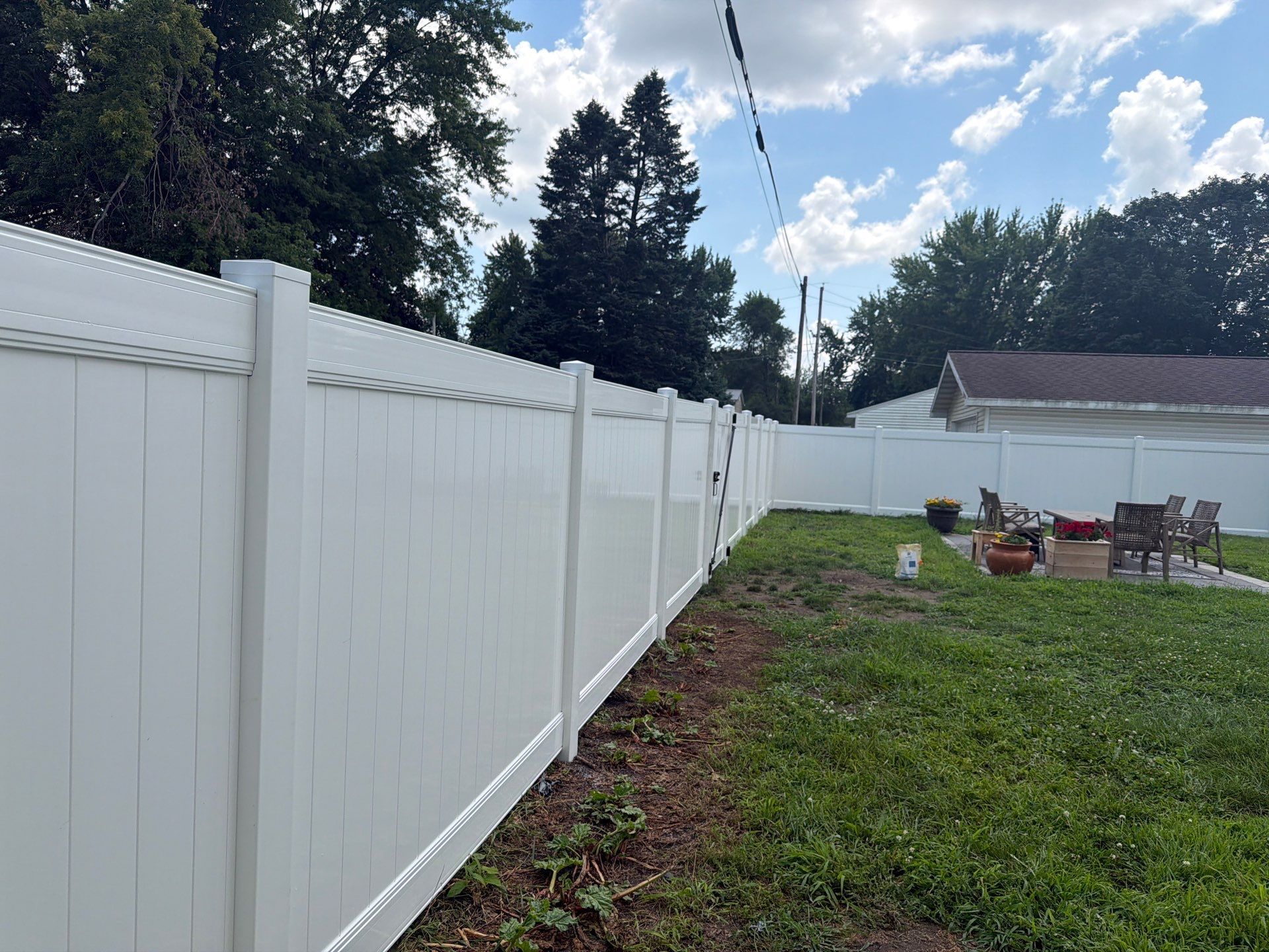White Vinyl Privacy Fence Installation in Waterloo, Iowa by Perfect Picket Fence and Stain