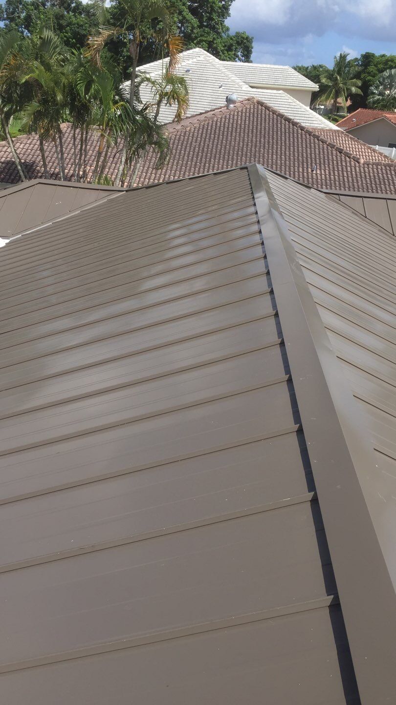 Residential Roofing Installation using 1" Nail strip metal roof by BLUES BROTHERS CONSTRUCTION CORP