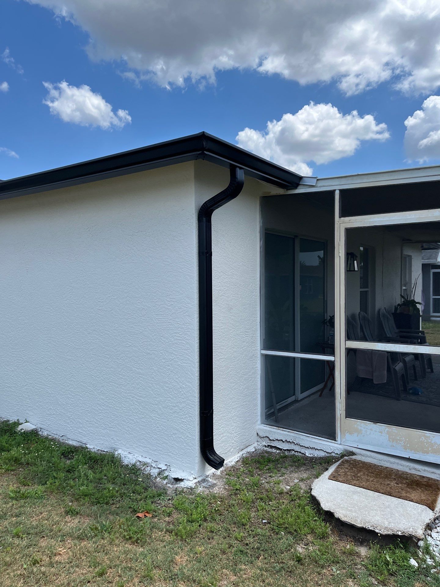 Black Seamless Gutters and Downspouts in Fort Myers FL by Gutter Professors