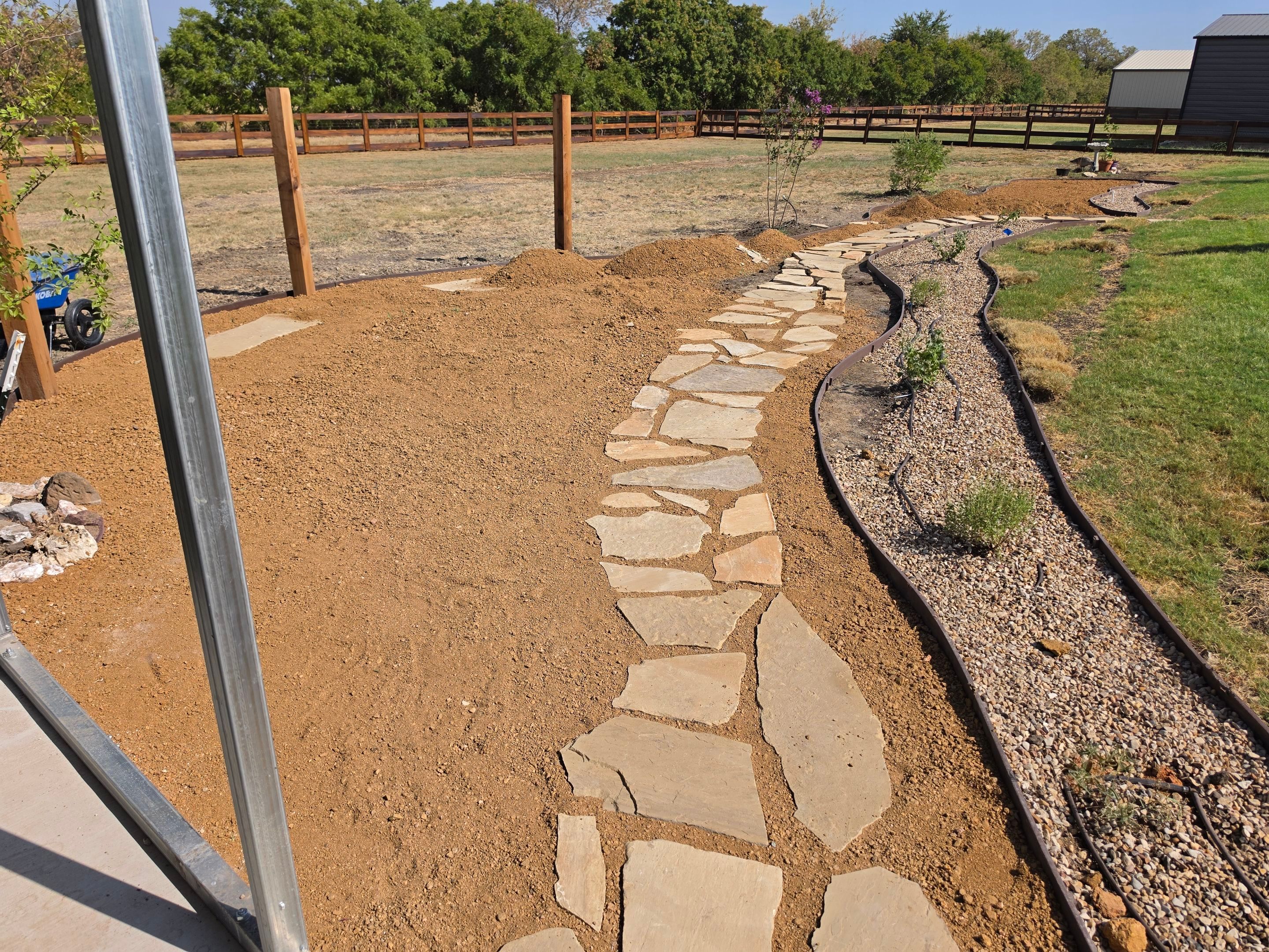 Argyle Residential Landscape Installation with Flagstone Path and Outdoor Seating by Conserva Irrigation NW Dallas