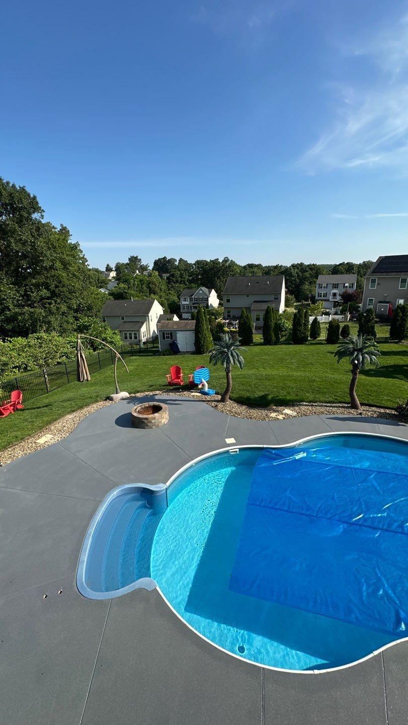 Twilight Pool Deck / Patio Project in Beaver falls by Floors in a Day, Inc