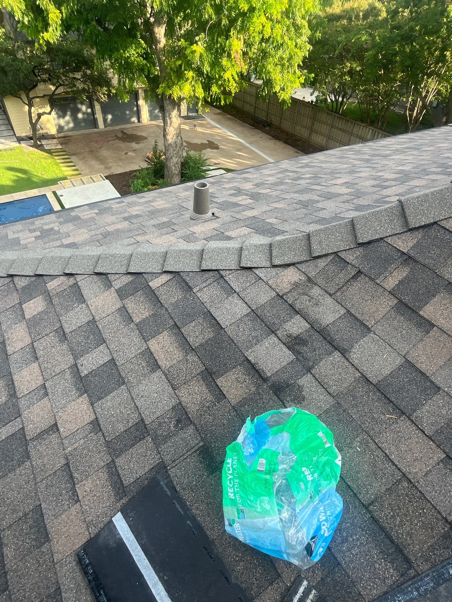 Tan exterior with IKO Driftshake by Tejas Roofworks + Restoration