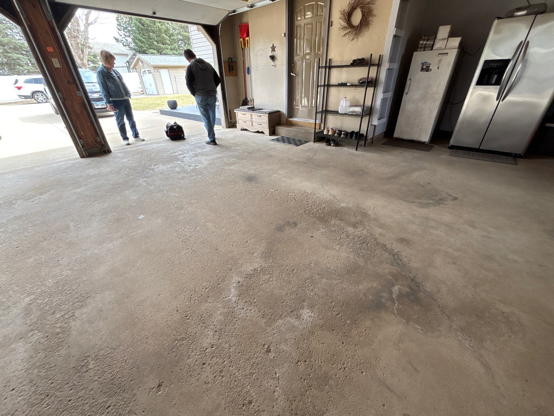 Full-Flake Epoxy Garage Floor Coating Installation in Sioux Falls by Select Painting, Coatings & Garage Cabinets
