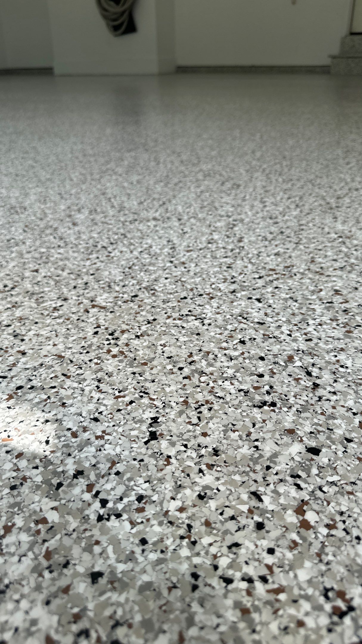 Robin K. decided coyote flake would look great in her garage and basement  by Banner Garage