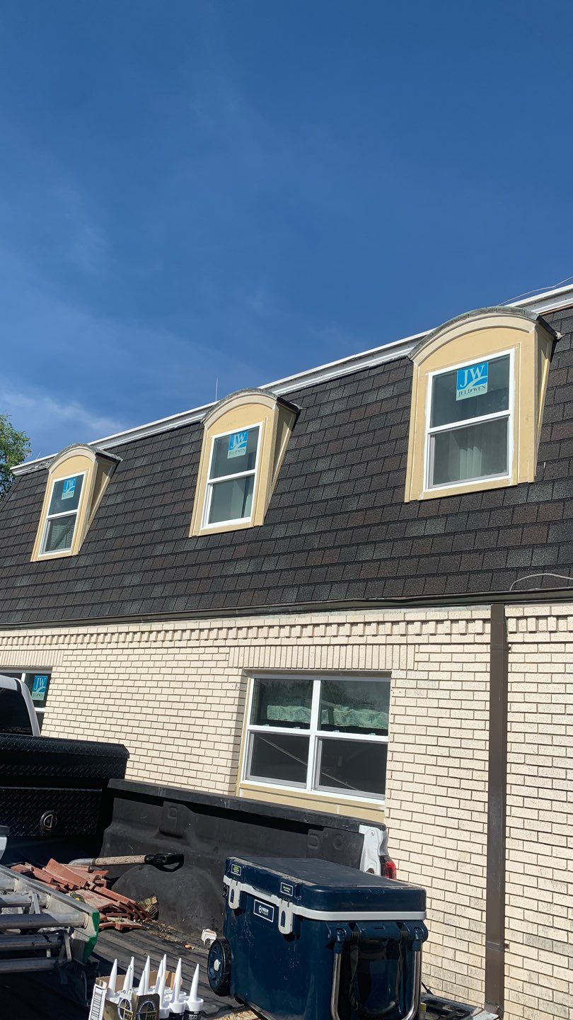 Mansard Charm by Bayfront Roofing and Construction