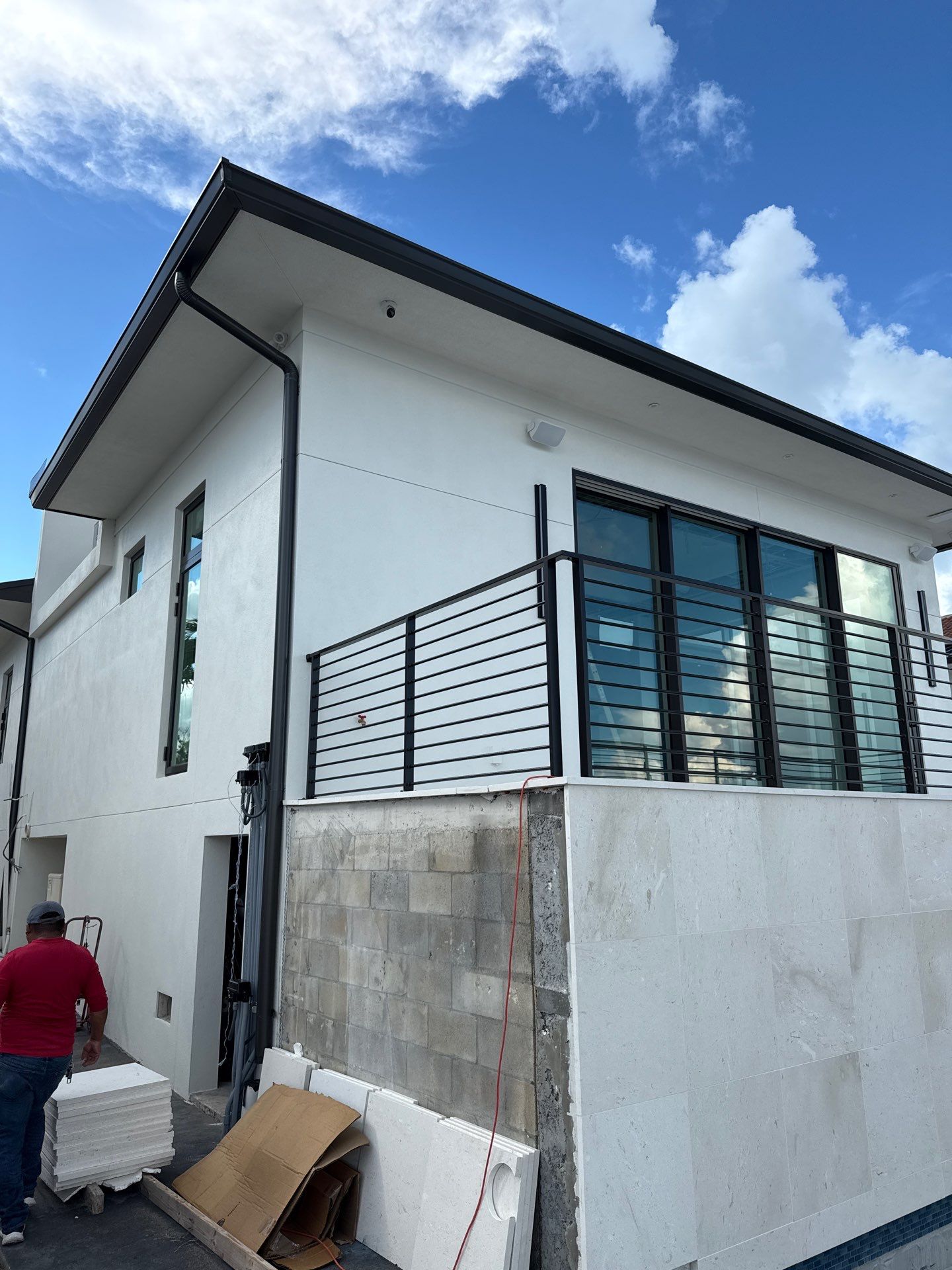 Seamless Aluminum Gutter Installation using black seamless gutters in Sarasota FL by Gutter Professors