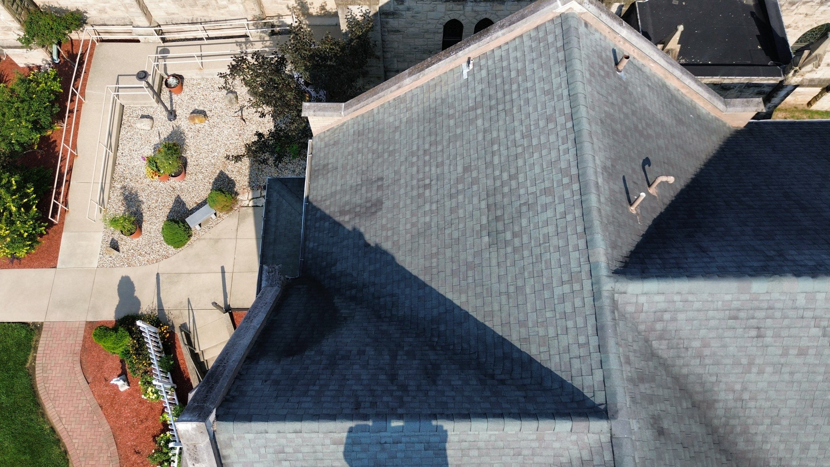 Commercial Roofing Installation using Standing Seam Metal - Frost Black by RoofX 