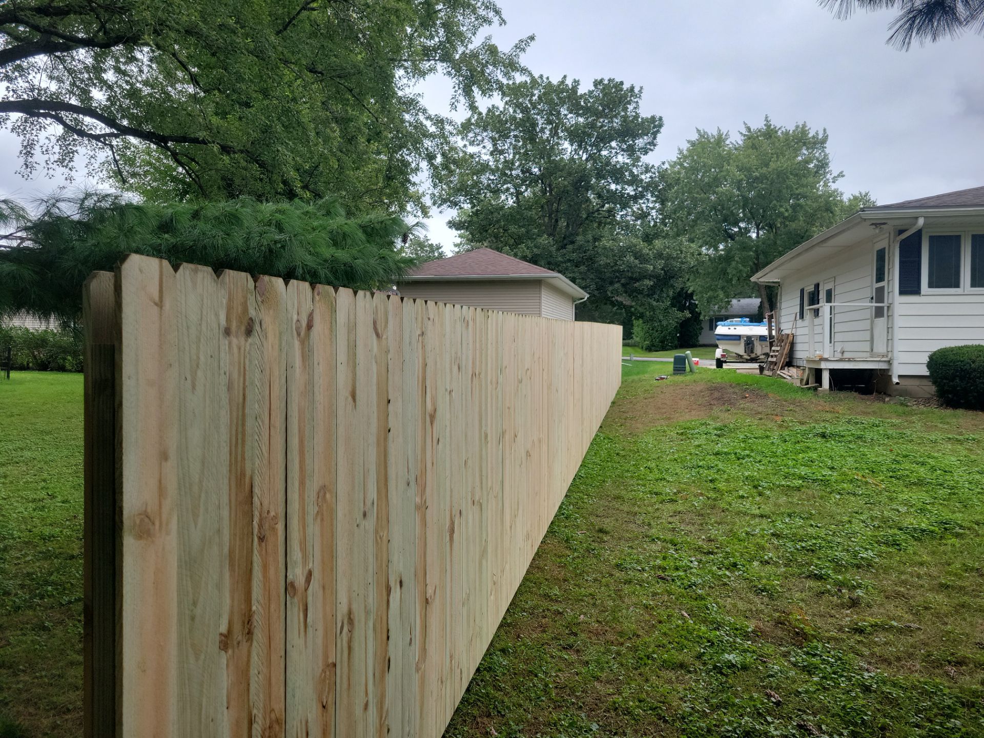 Pressure-Treated Wood Privacy Fence Installation in Waverly by Perfect Picket Fence and Stain