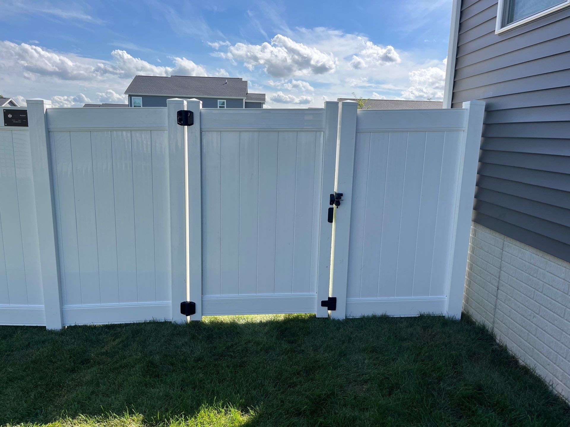 New Vinyl Privacy Fencing and Gates for Waterloo Residential Backyard by Perfect Picket Fence and Stain