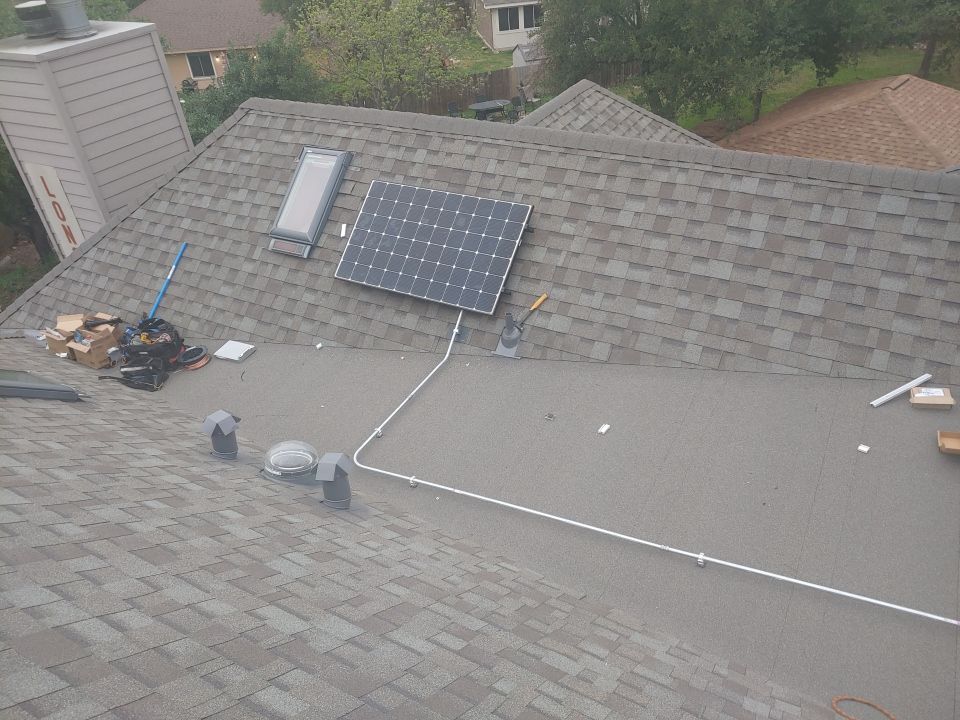 Residential Roof Replacement and Solar Panel Integration in Austin by Caliber Restoration LLC