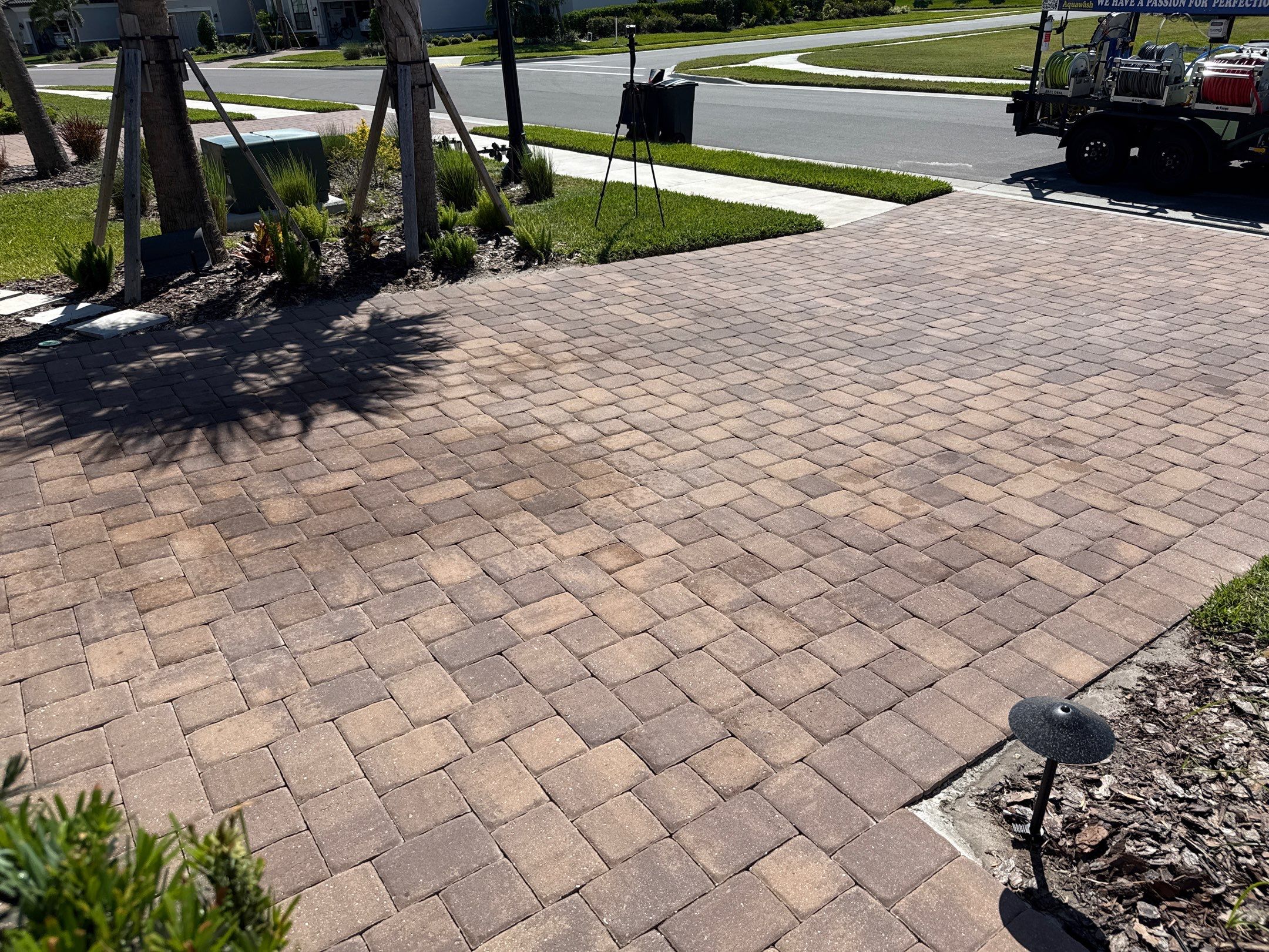 Oil Stain Removal on Paver Driveway | Esplanade at Artisan Lakes, Palmetto FL by Sunshine AquaWash